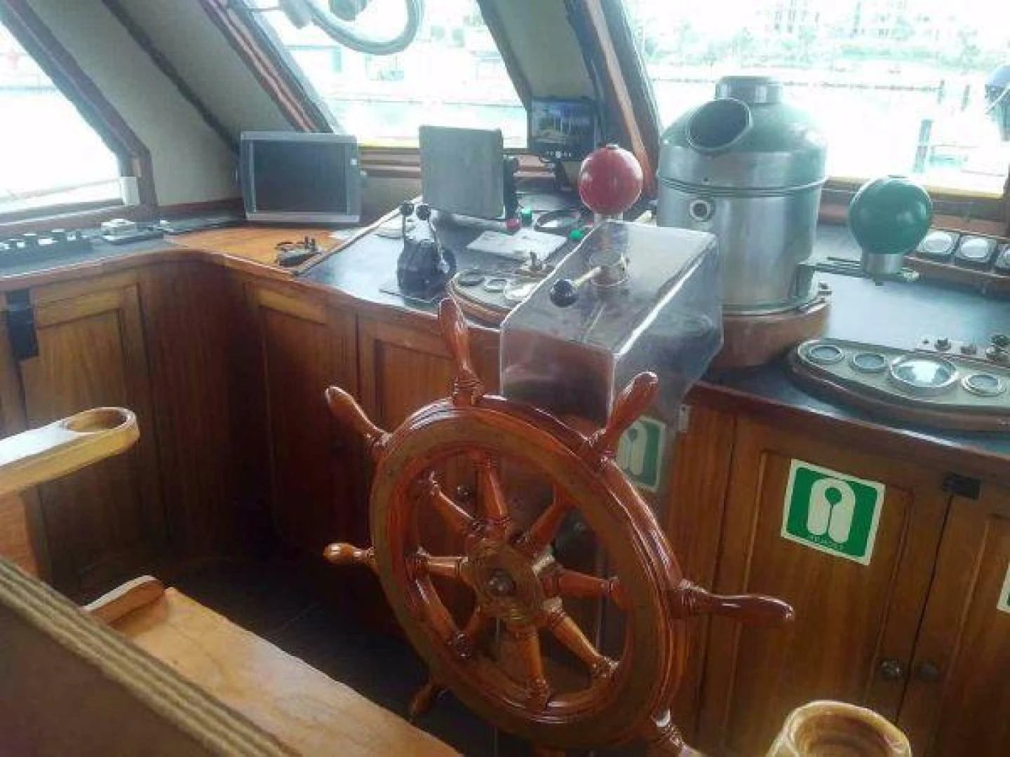 a wooden steering wheel in a room aboard STAR ALLIANCE Yacht for Sale