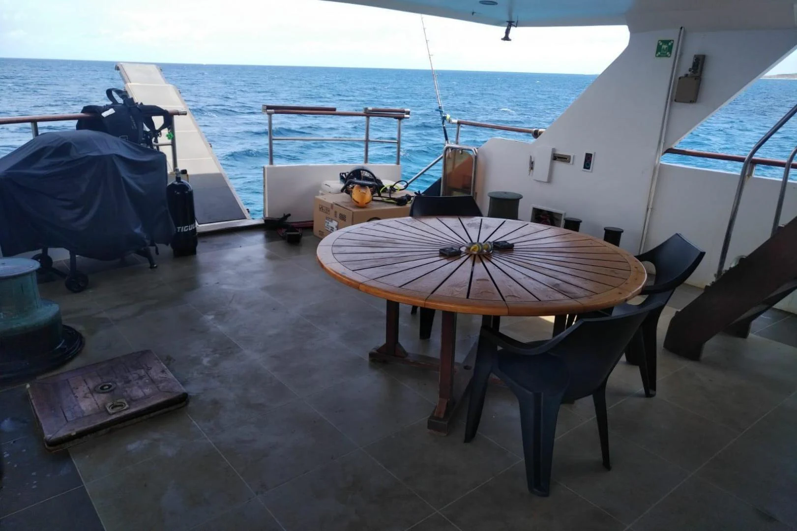 a table and chairs on a deck aboard STAR ALLIANCE Yacht for Sale
