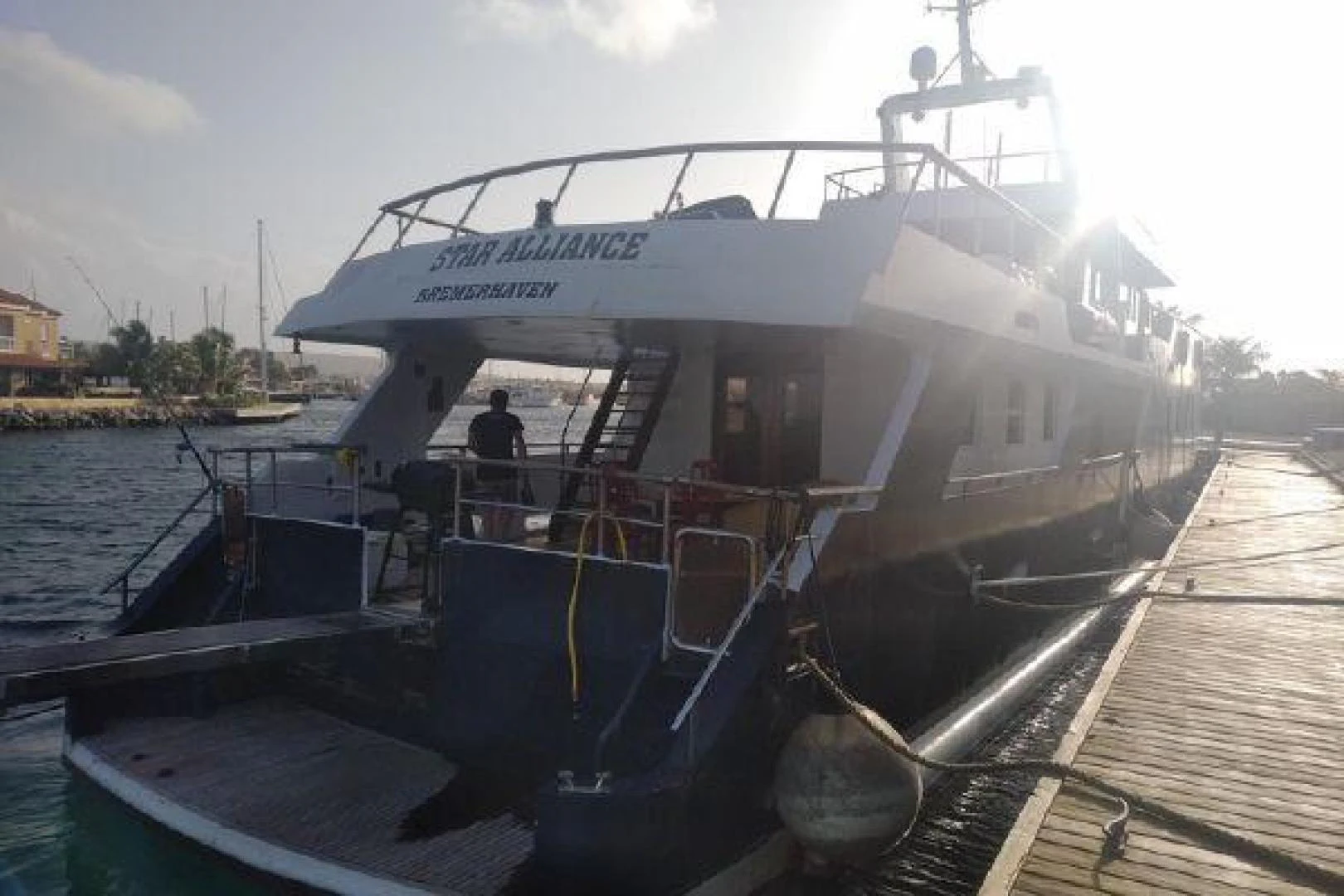 a boat docked at a pier aboard STAR ALLIANCE Yacht for Sale