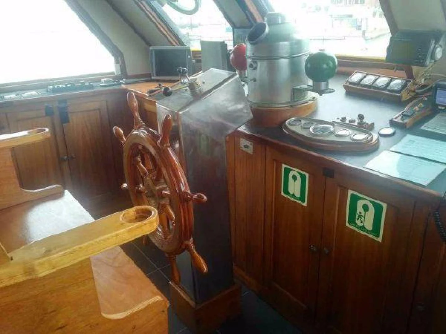 a wooden kitchen with a large wooden stove and a wooden table aboard STAR ALLIANCE Yacht for Sale