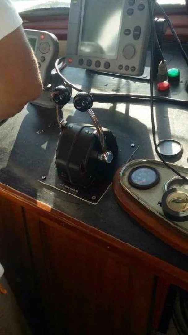 a person holding a device aboard STAR ALLIANCE Yacht for Sale