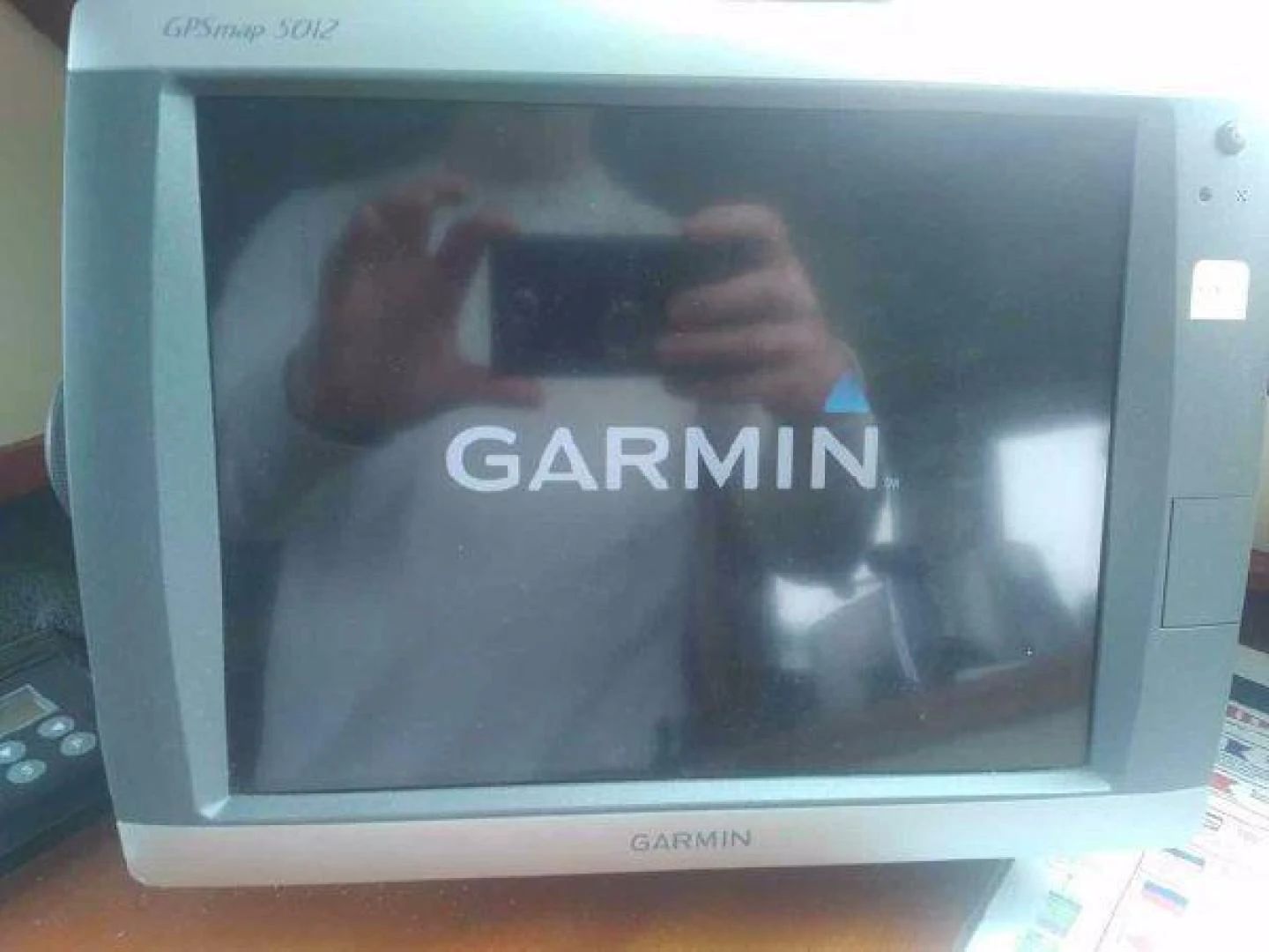 a person taking a picture of himself in a mirror aboard STAR ALLIANCE Yacht for Sale