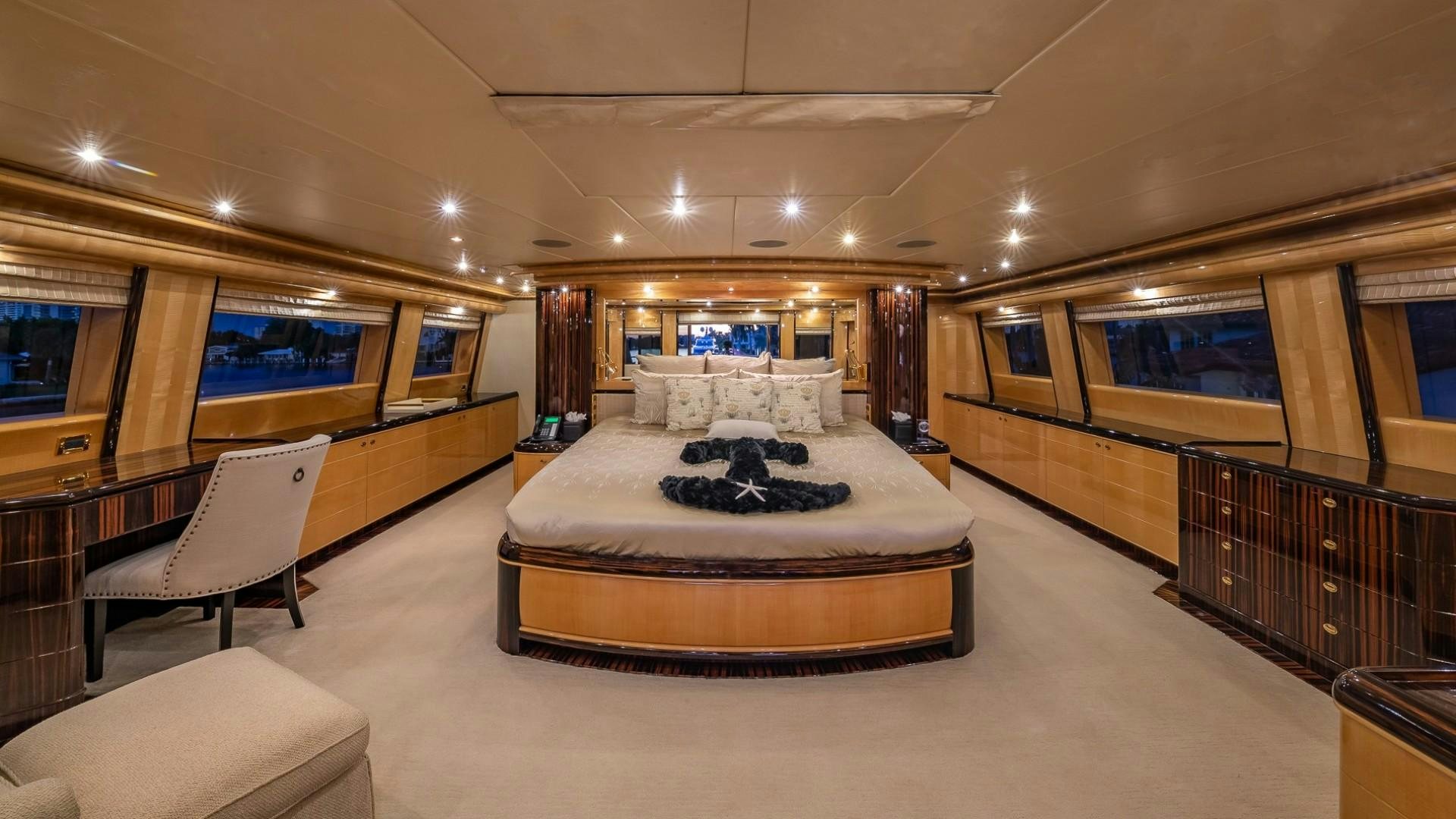 a large hotel room with a large bed and a large window aboard LADY LEILA Yacht for Sale