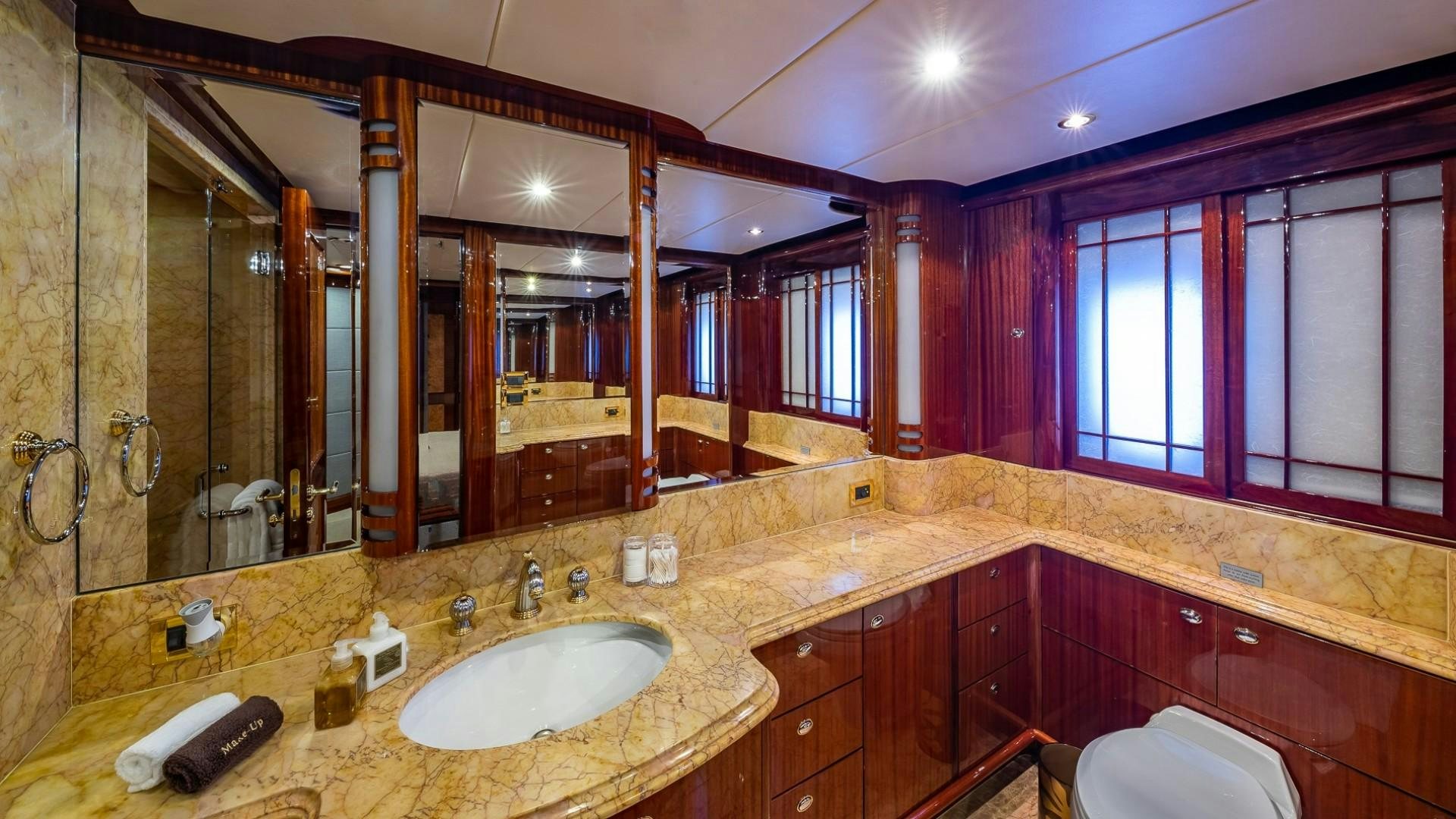 a bathroom with a large mirror aboard LADY LEILA Yacht for Sale