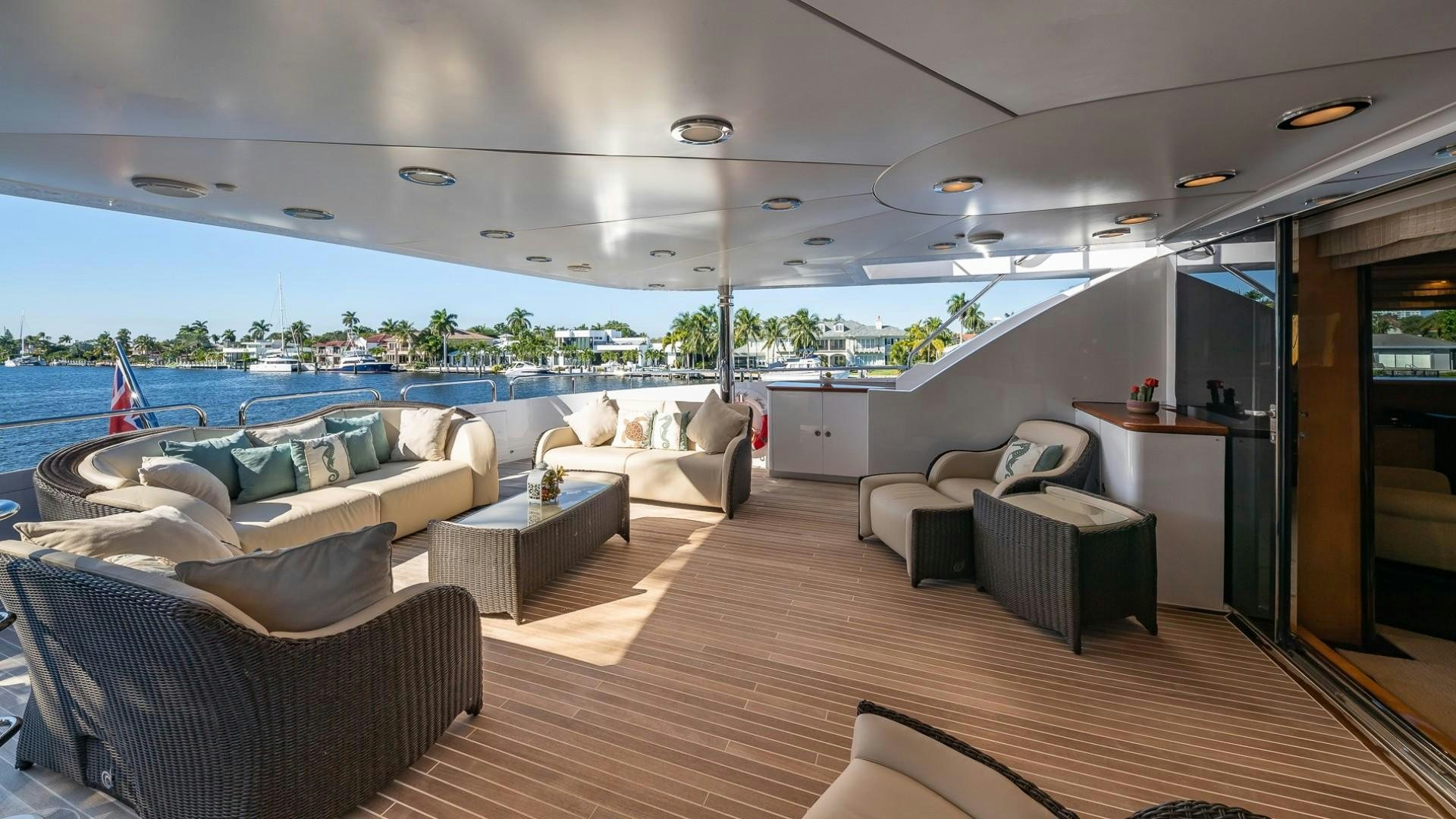 a room with a couch and a table and a pool aboard LADY LEILA Yacht for Sale