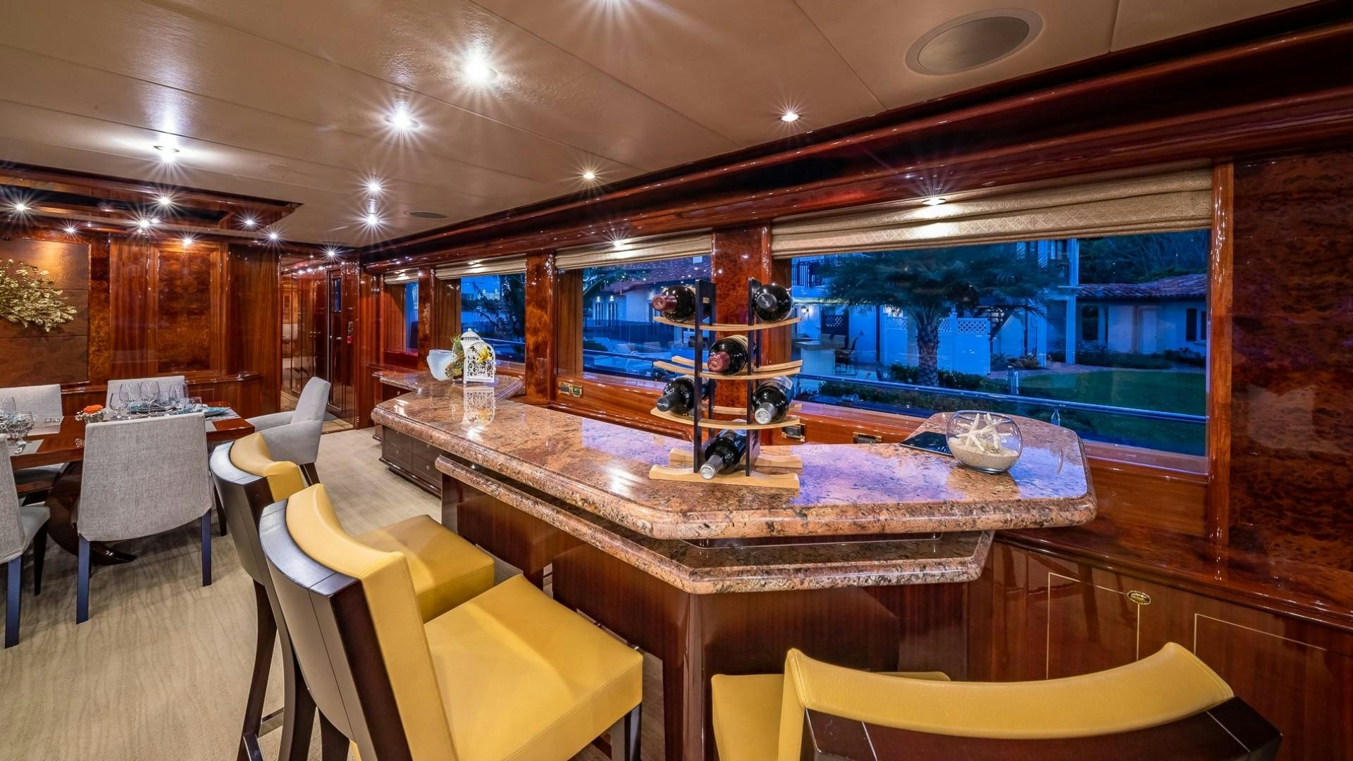 a bar with a table and chairs aboard LADY LEILA Yacht for Sale