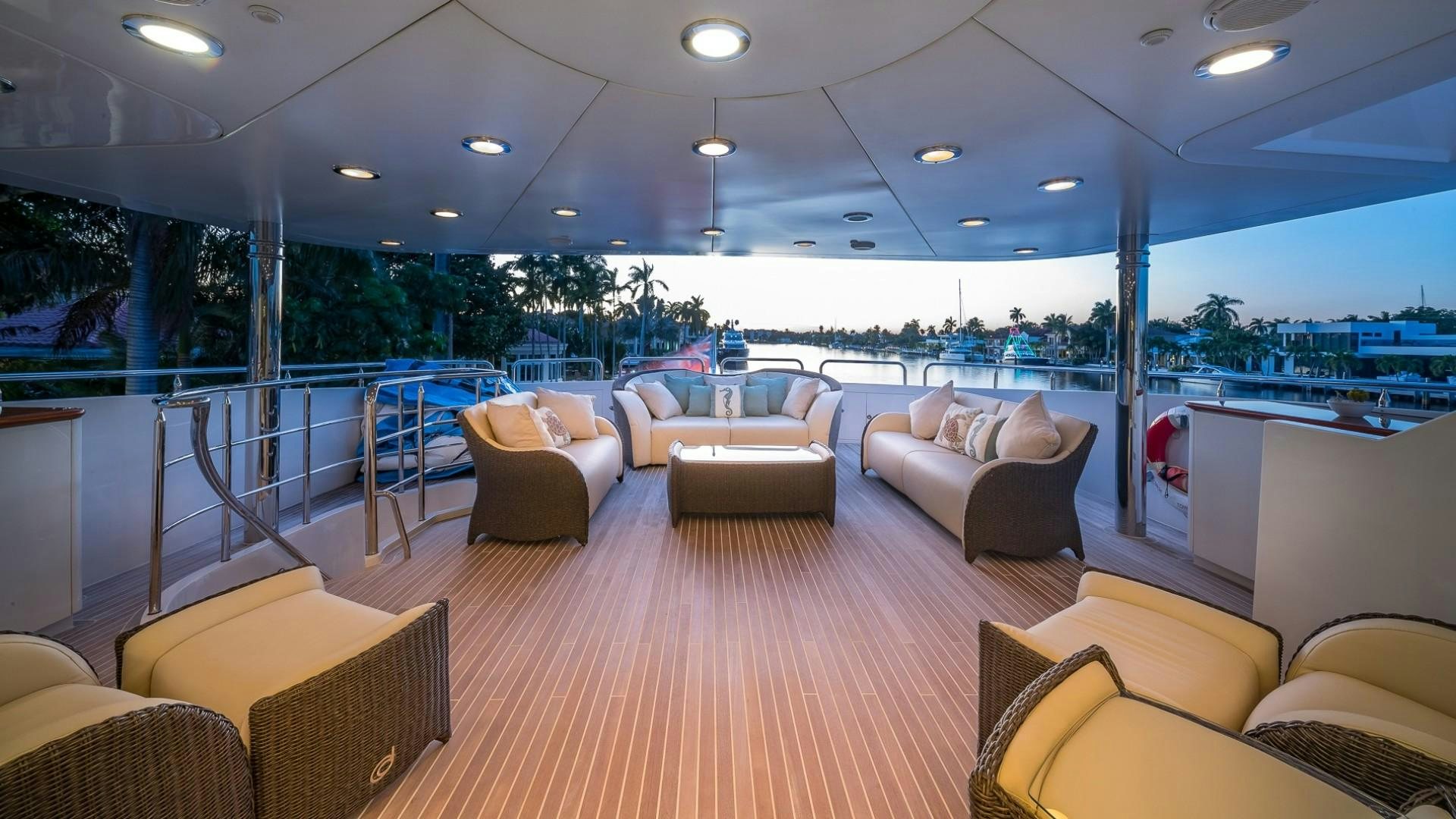 a large room with couches and a table aboard LADY LEILA Yacht for Sale
