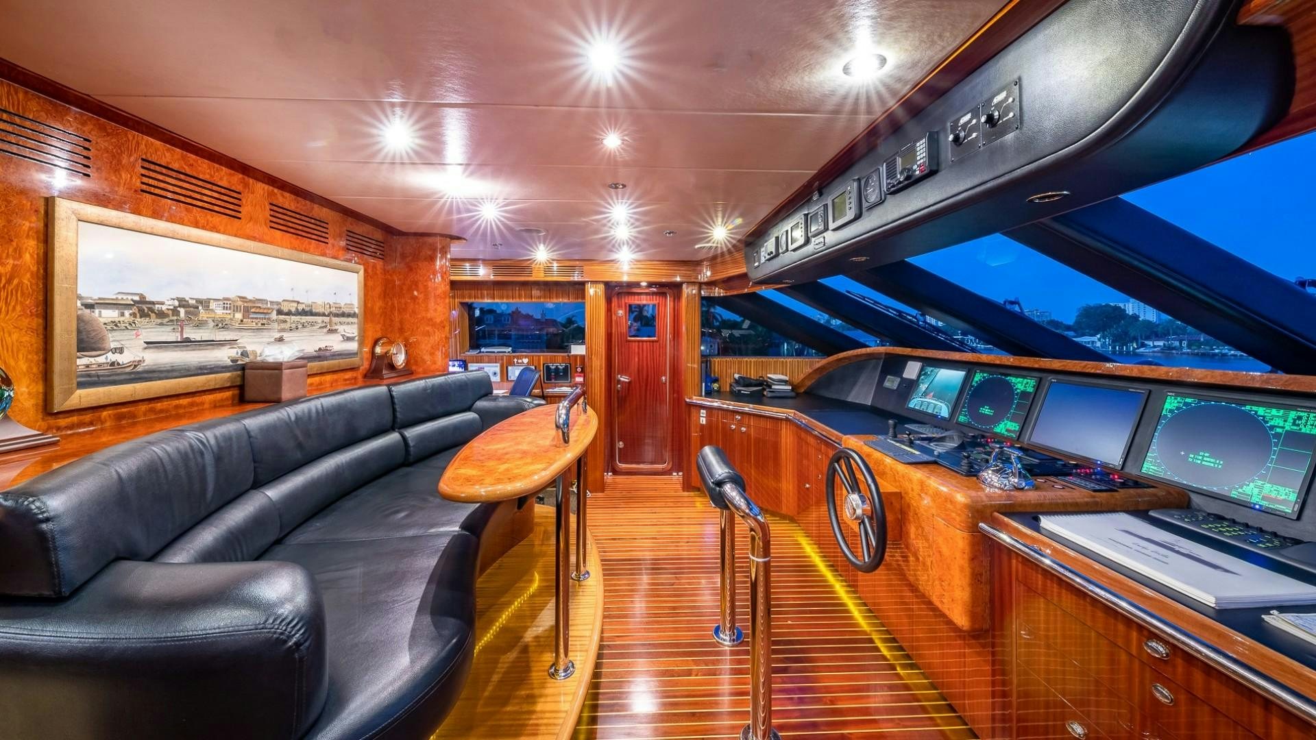 inside of a building with a piano and a table and chairs aboard LADY LEILA Yacht for Sale