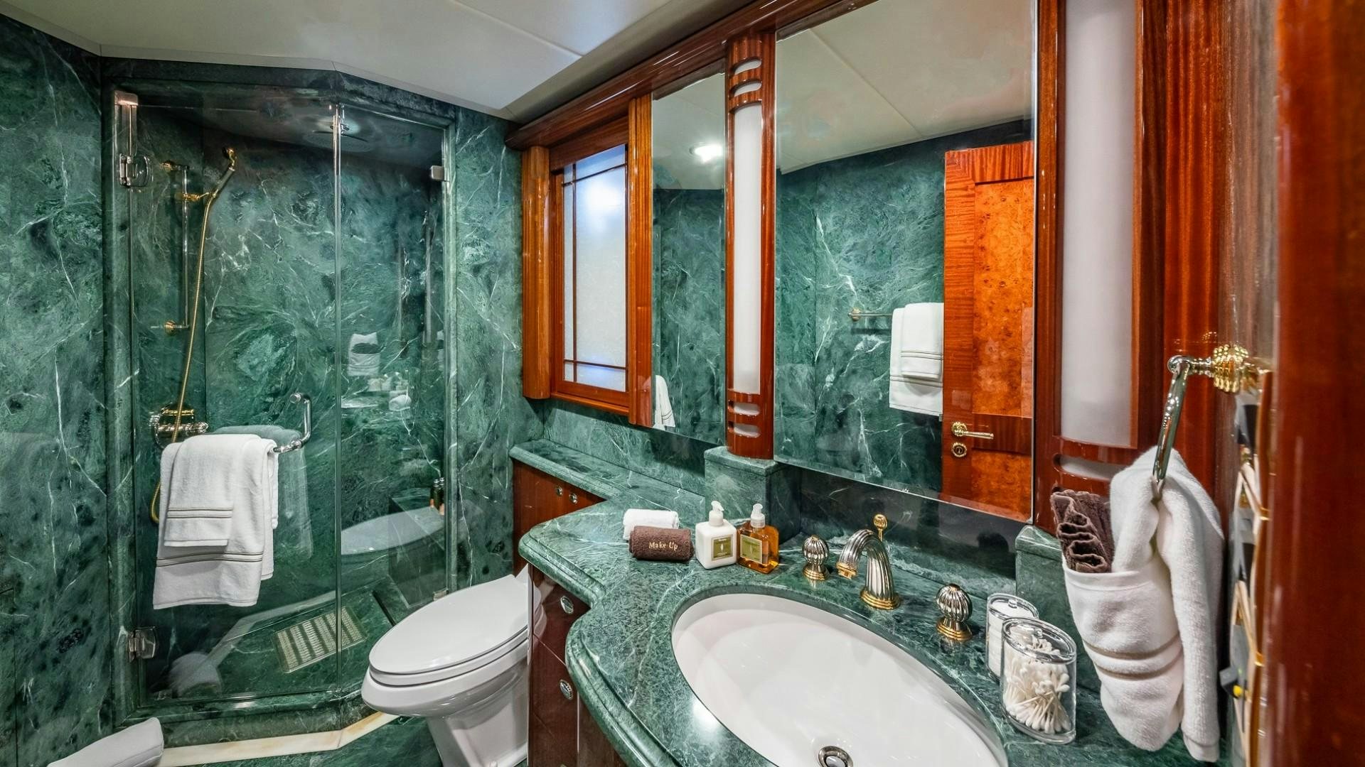 a bathroom with a large mirror aboard LADY LEILA Yacht for Sale