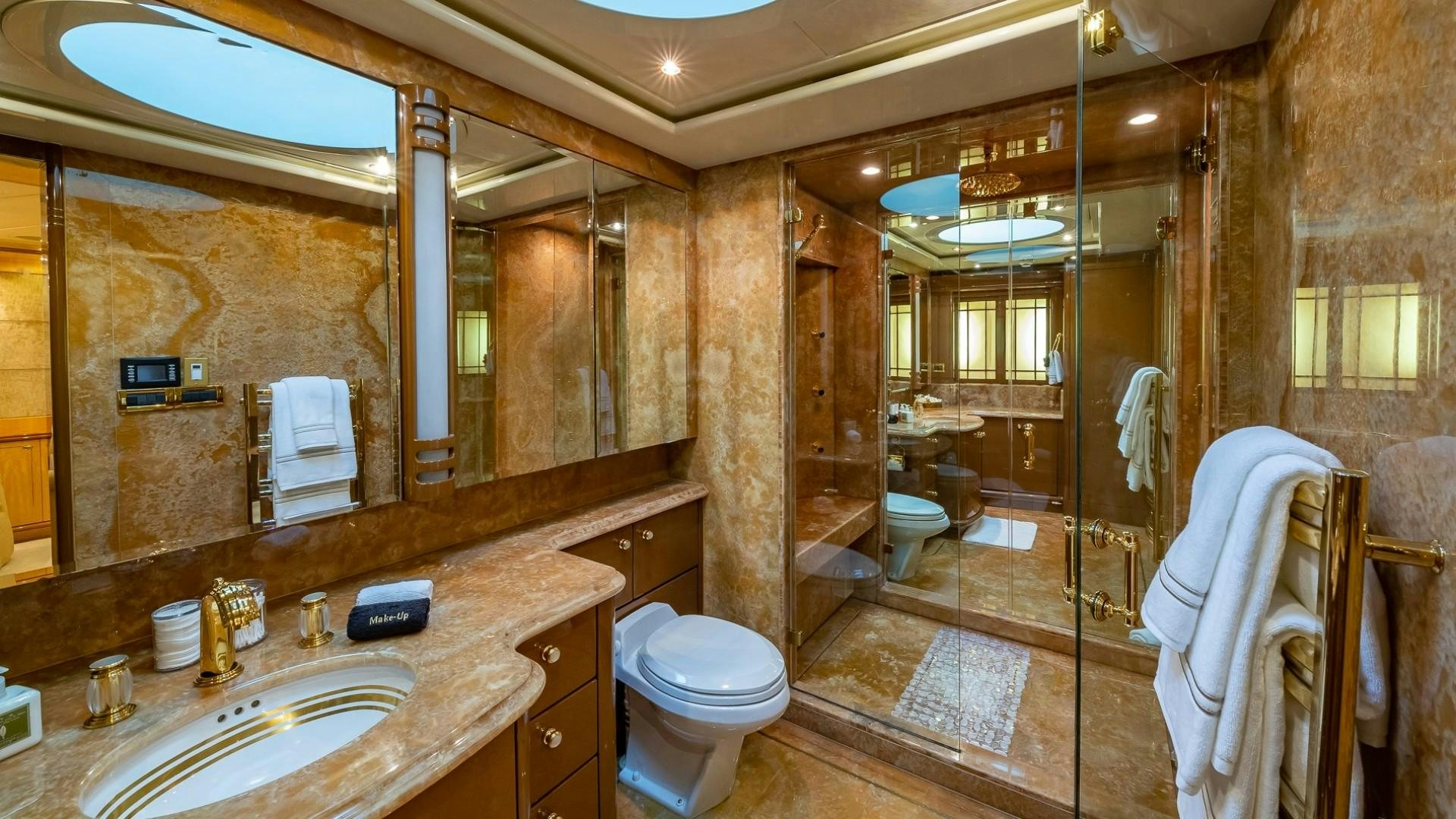 a bathroom with a glass shower aboard LADY LEILA Yacht for Sale