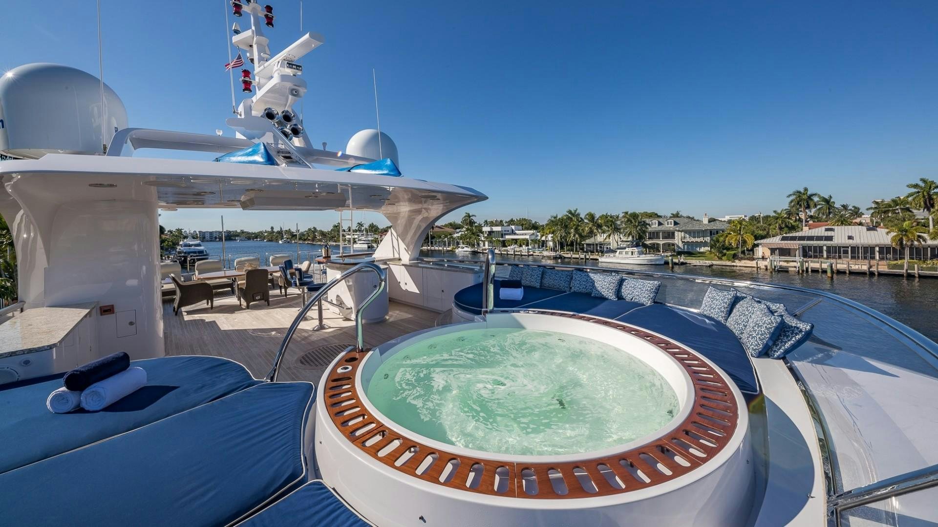 a pool with a water slide and a satellite dish on the roof aboard LADY LEILA Yacht for Sale