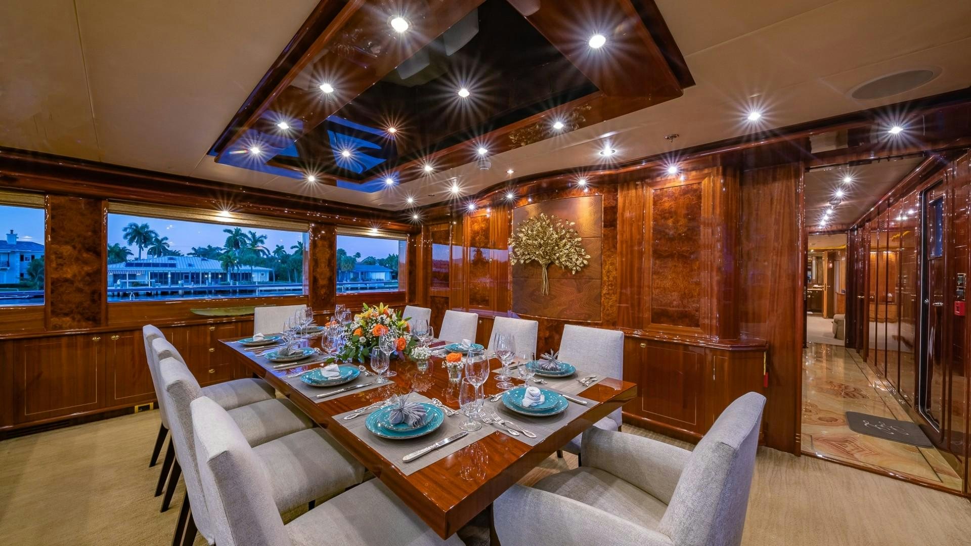 a dining room with a table and chairs aboard LADY LEILA Yacht for Sale