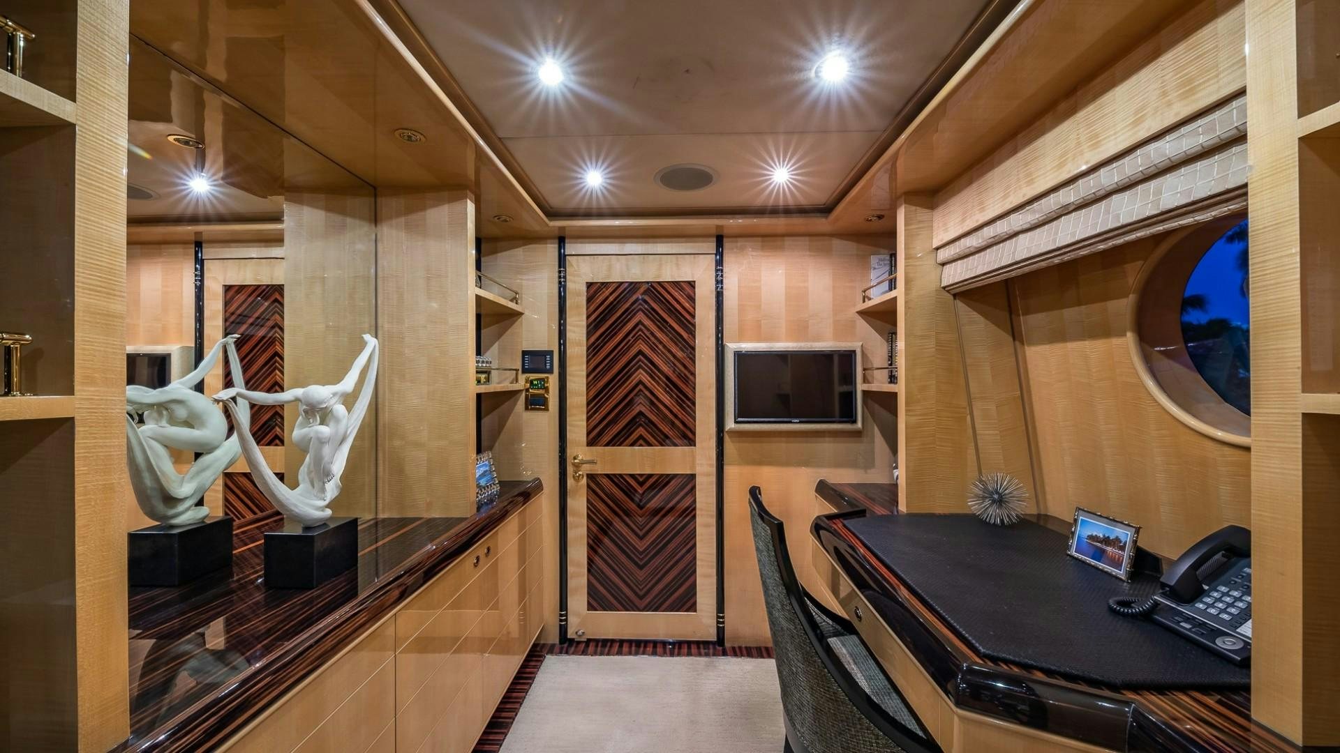 a room with a desk and a computer aboard LADY LEILA Yacht for Sale