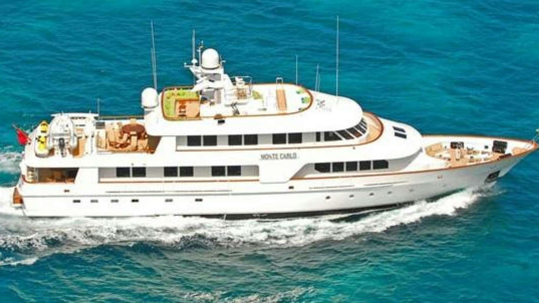 a white boat on the water aboard MONTE CARLO Yacht for Sale