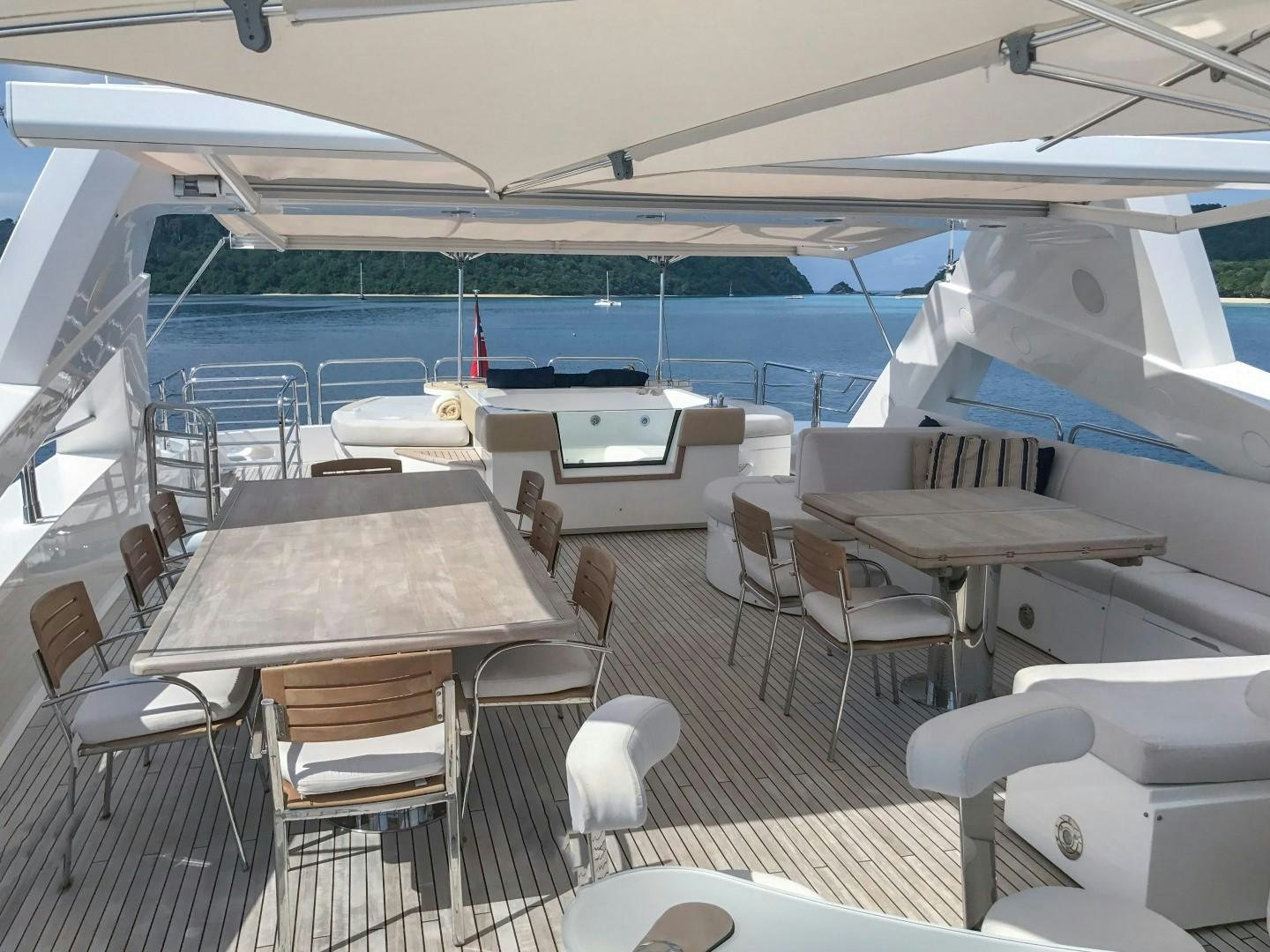 a room with tables and chairs aboard ABOUT TIME Yacht for Sale