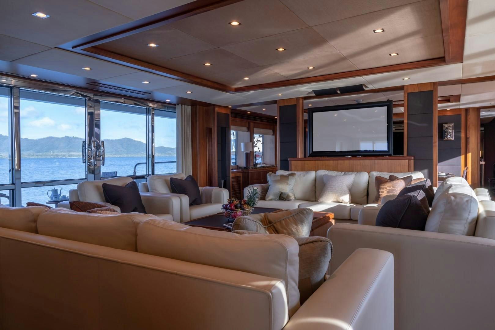 a living room with a large window aboard ABOUT TIME Yacht for Sale
