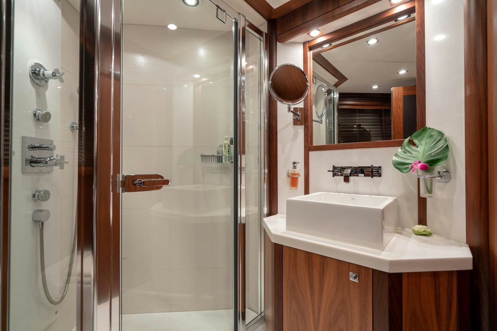 a bathroom with a sink and a shower aboard ABOUT TIME Yacht for Sale