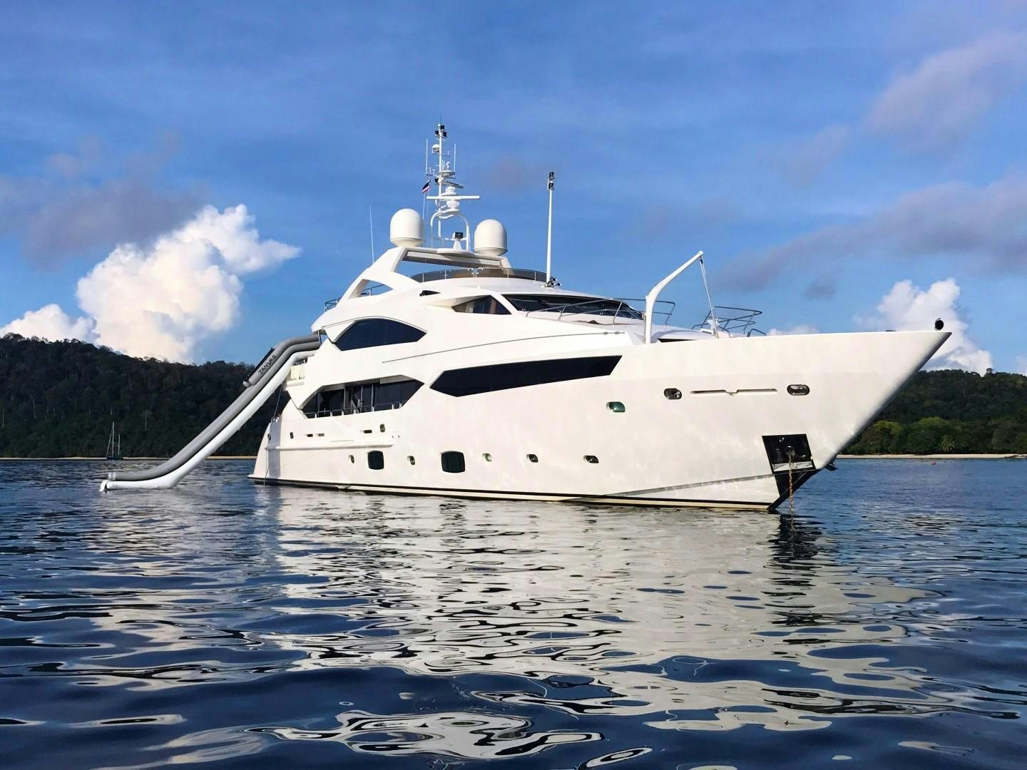 a white yacht on the water aboard ABOUT TIME Yacht for Sale