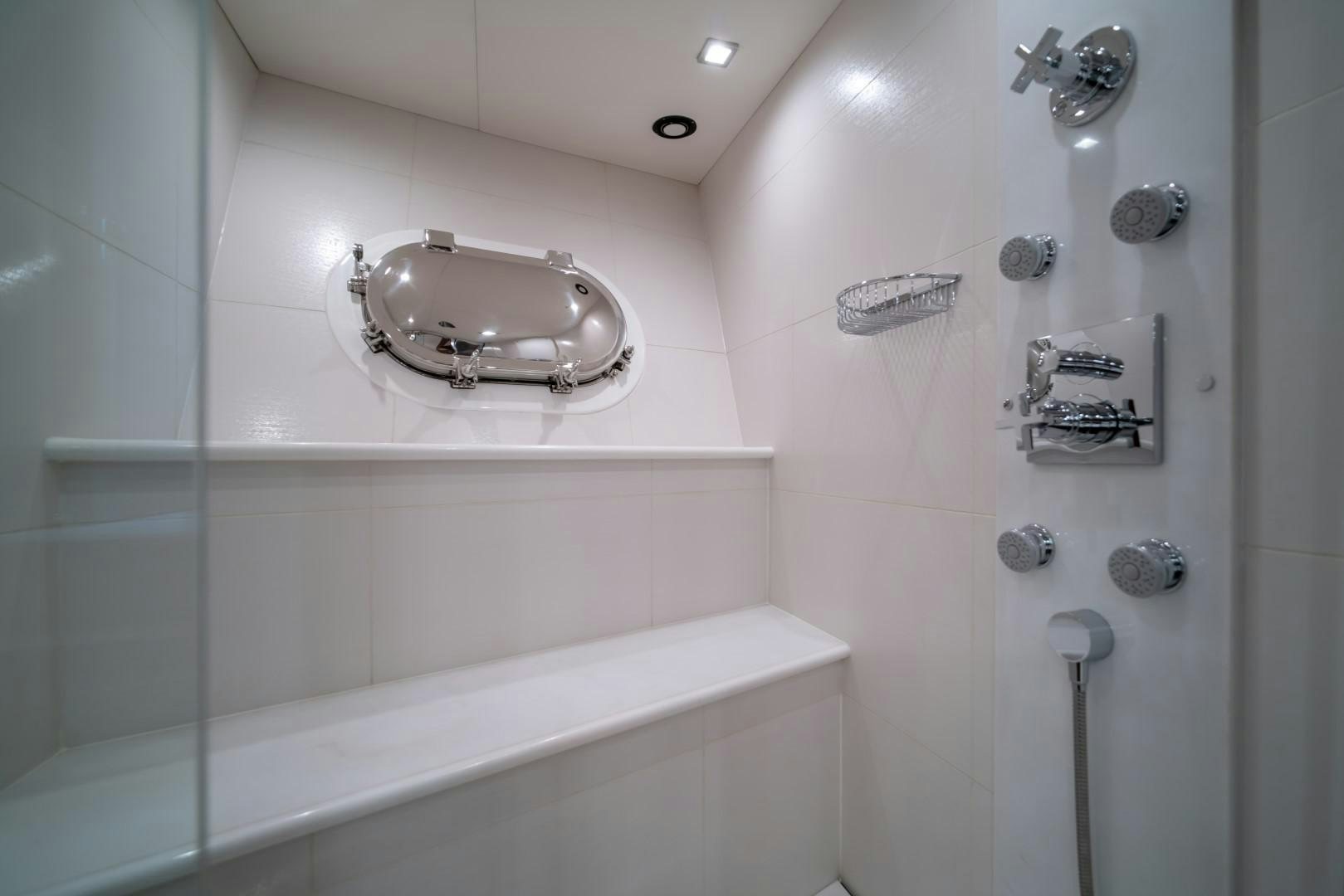a bathroom with a shower and a sink aboard ABOUT TIME Yacht for Sale