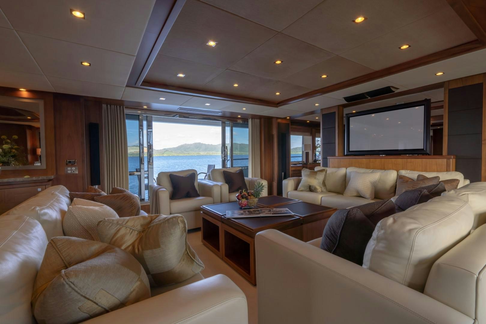 a living room with a large window aboard ABOUT TIME Yacht for Sale
