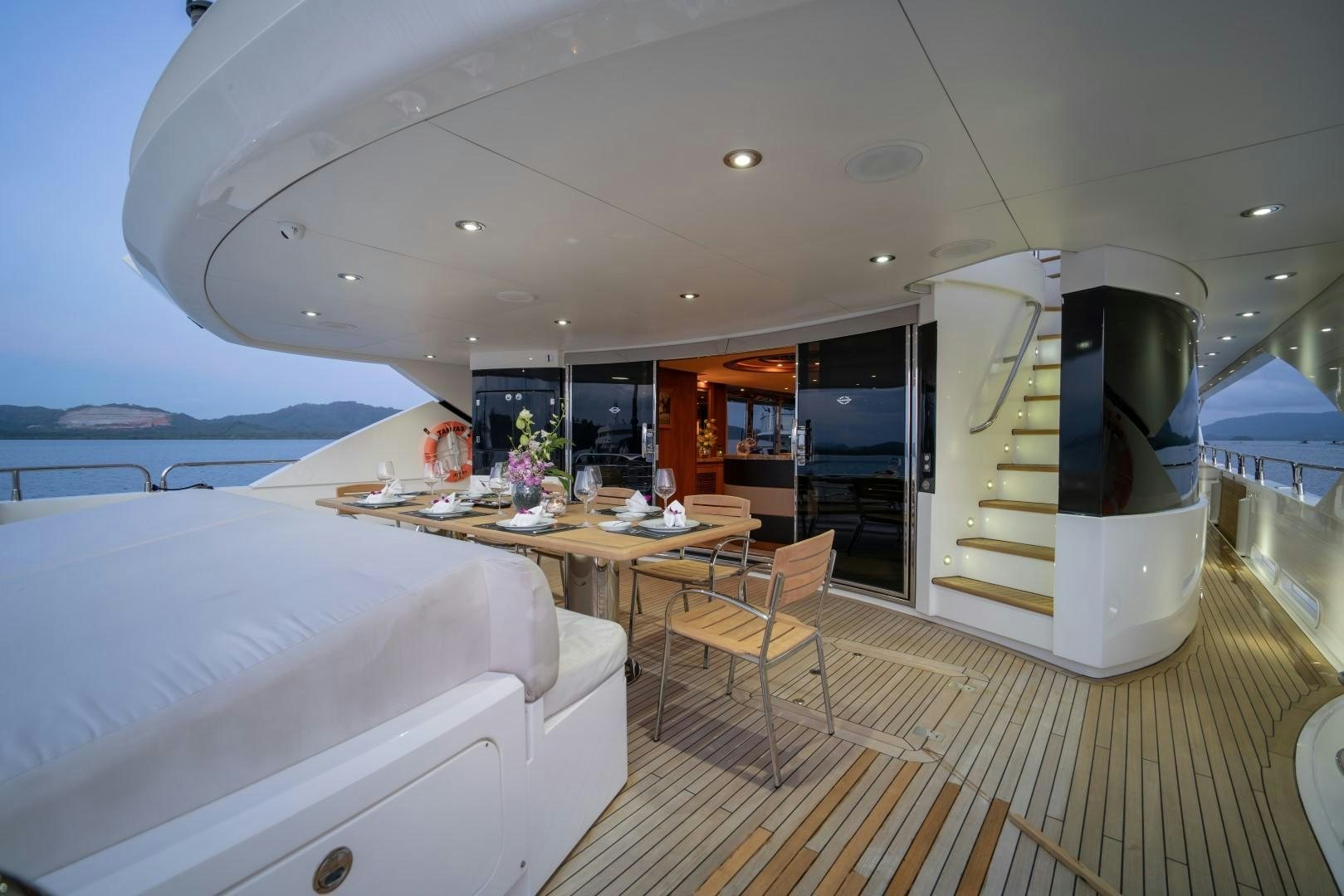 a room with a bed and a desk aboard ABOUT TIME Yacht for Sale