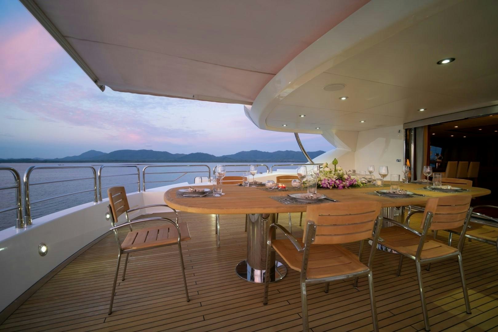 a restaurant with a view of the ocean aboard ABOUT TIME Yacht for Sale