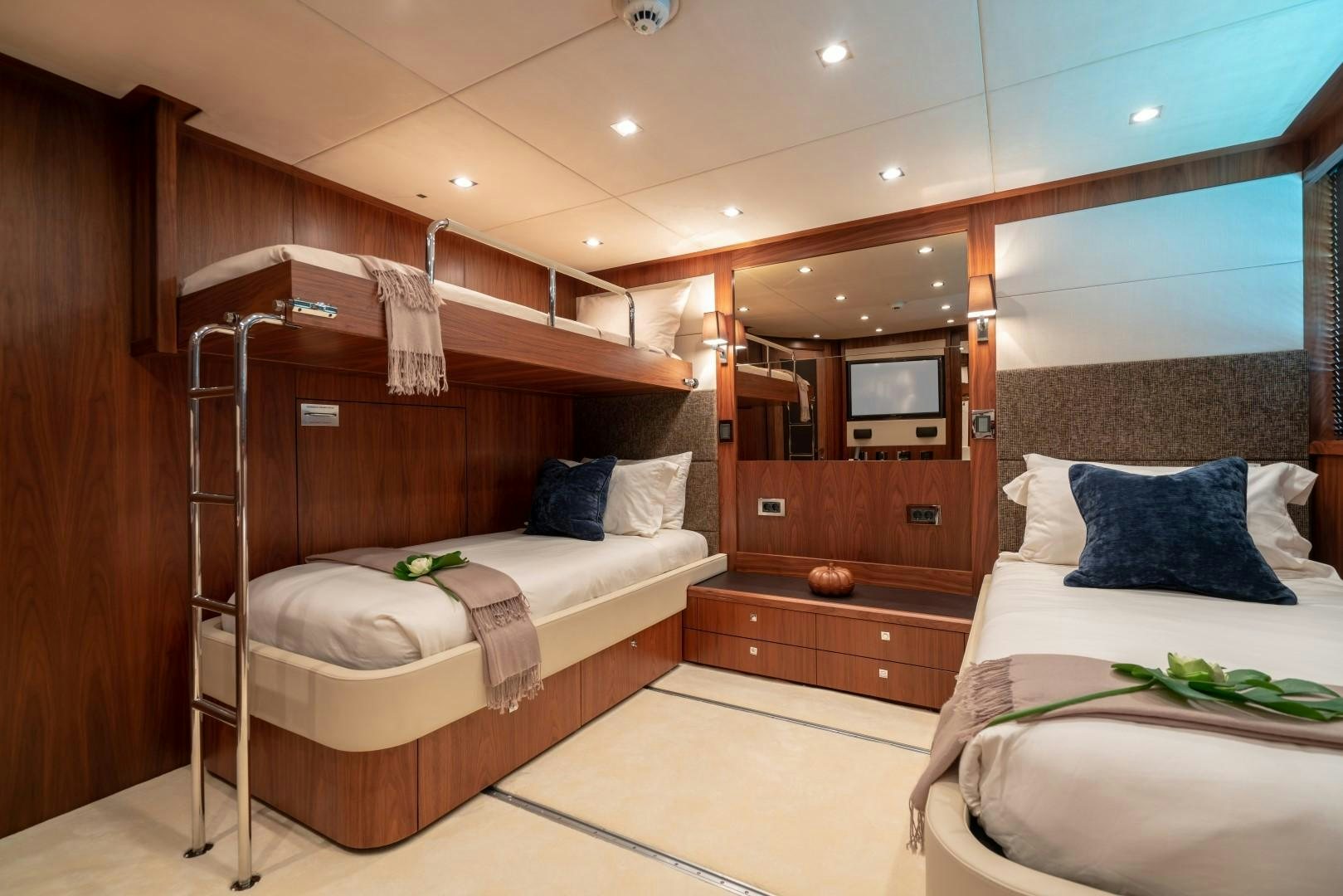 a room with a bed and a mirror aboard ABOUT TIME Yacht for Sale