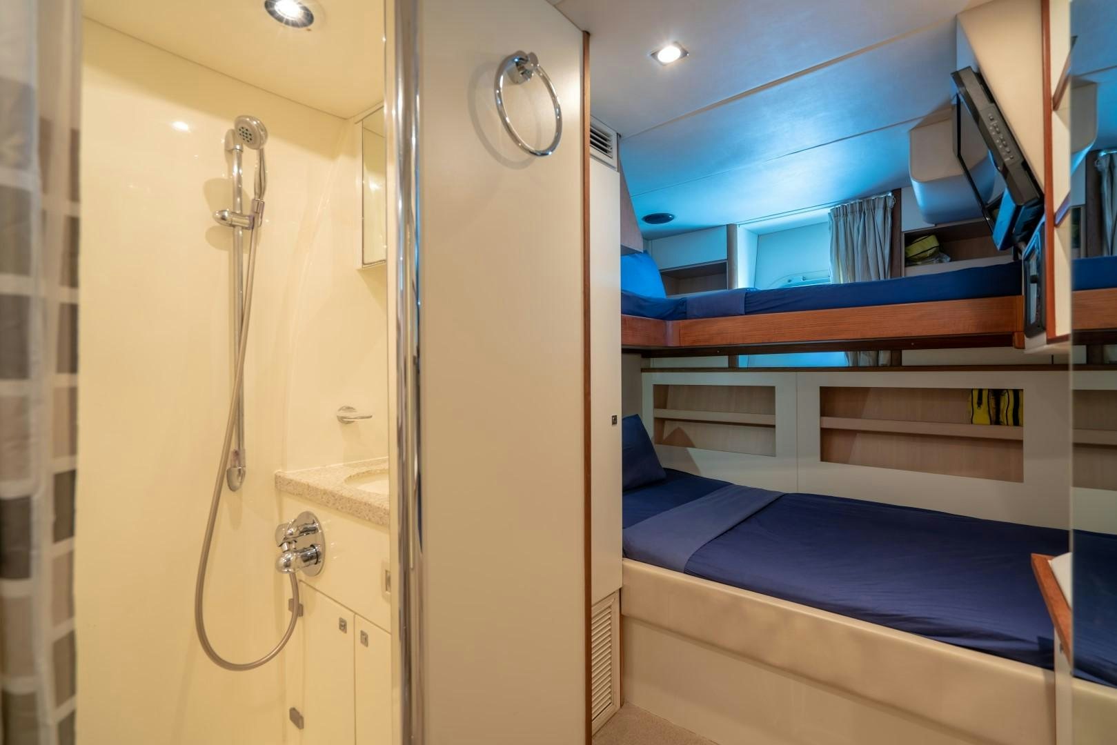 a room with a bunk bed and a closet aboard ABOUT TIME Yacht for Sale