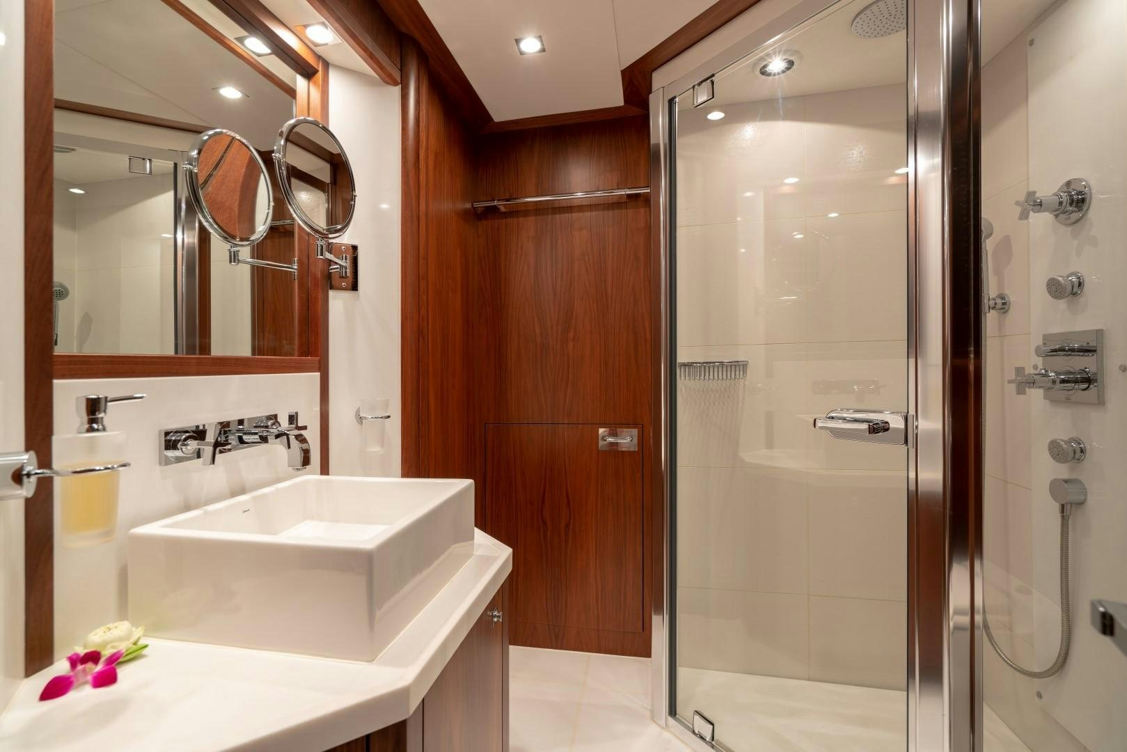 a bathroom with a large shower aboard ABOUT TIME Yacht for Sale