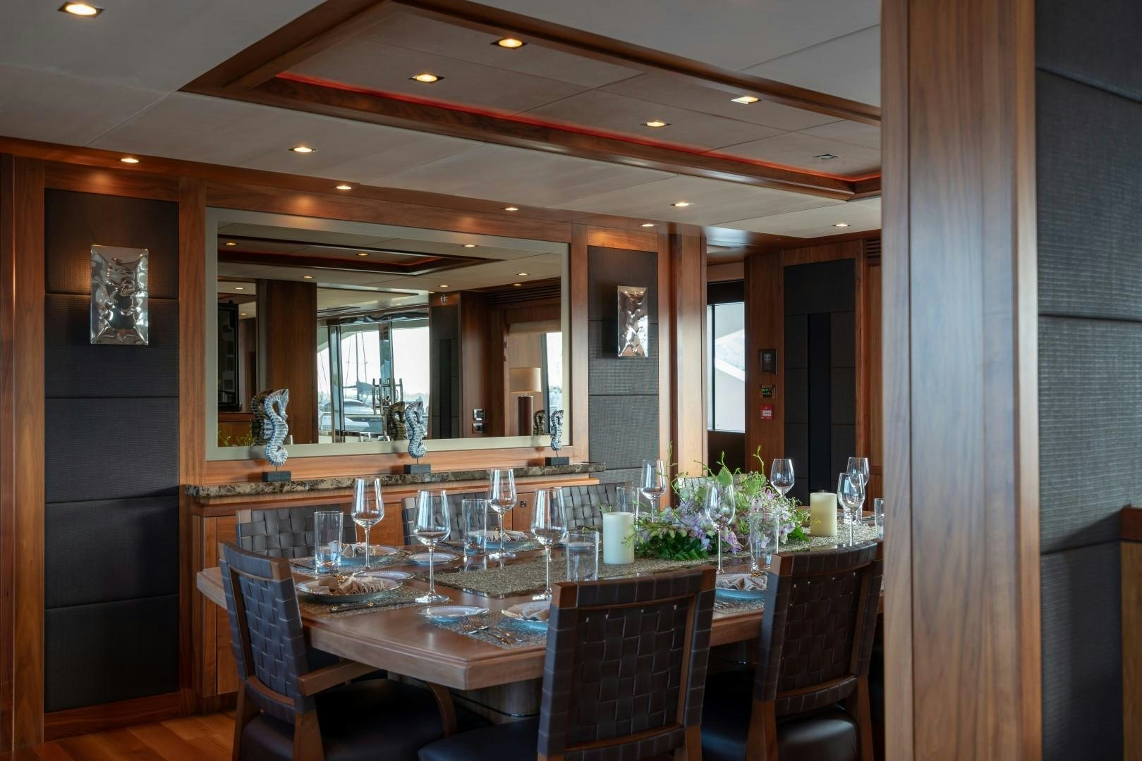 a dining room with a table and chairs aboard ABOUT TIME Yacht for Sale