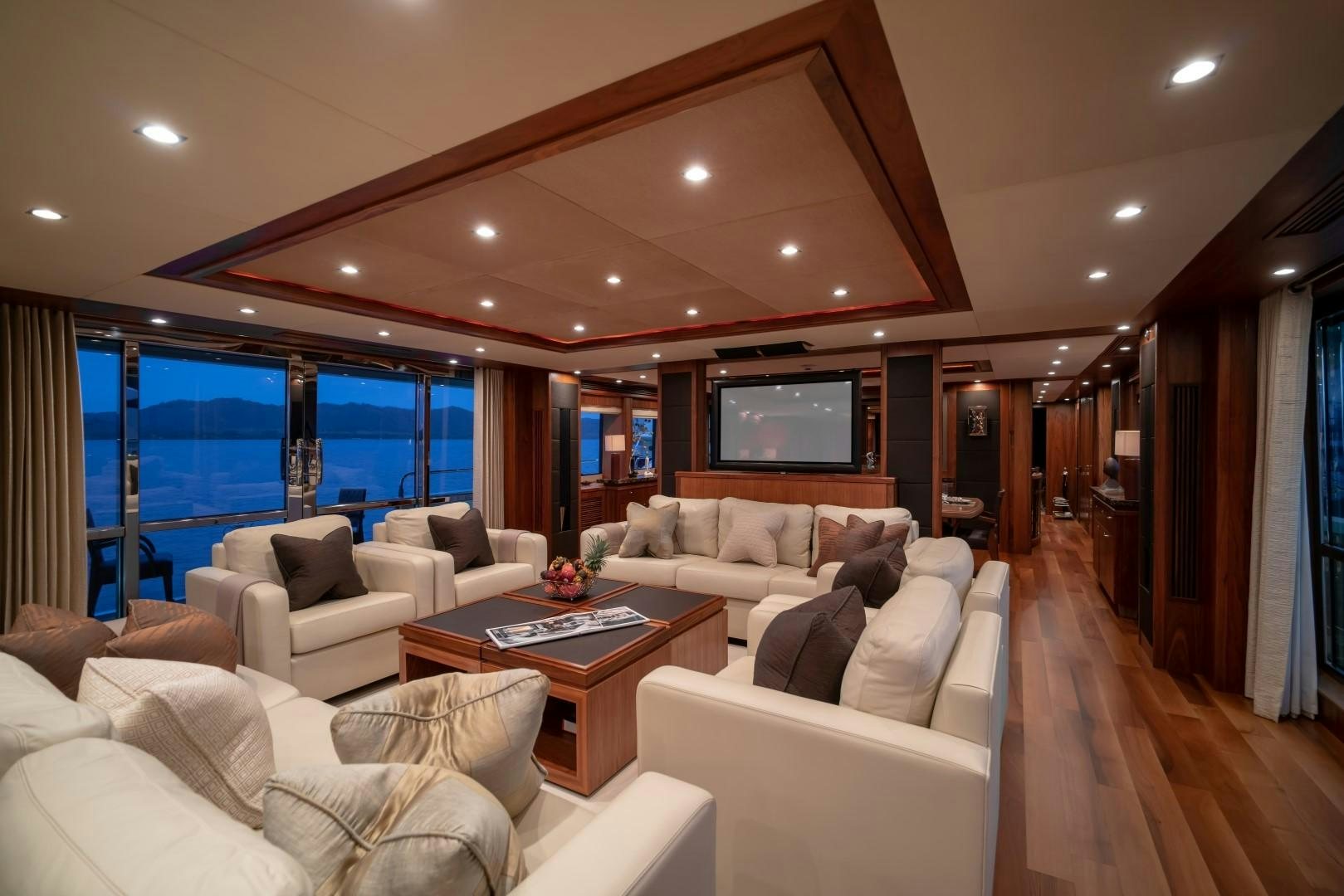 a living room with a large window aboard ABOUT TIME Yacht for Sale