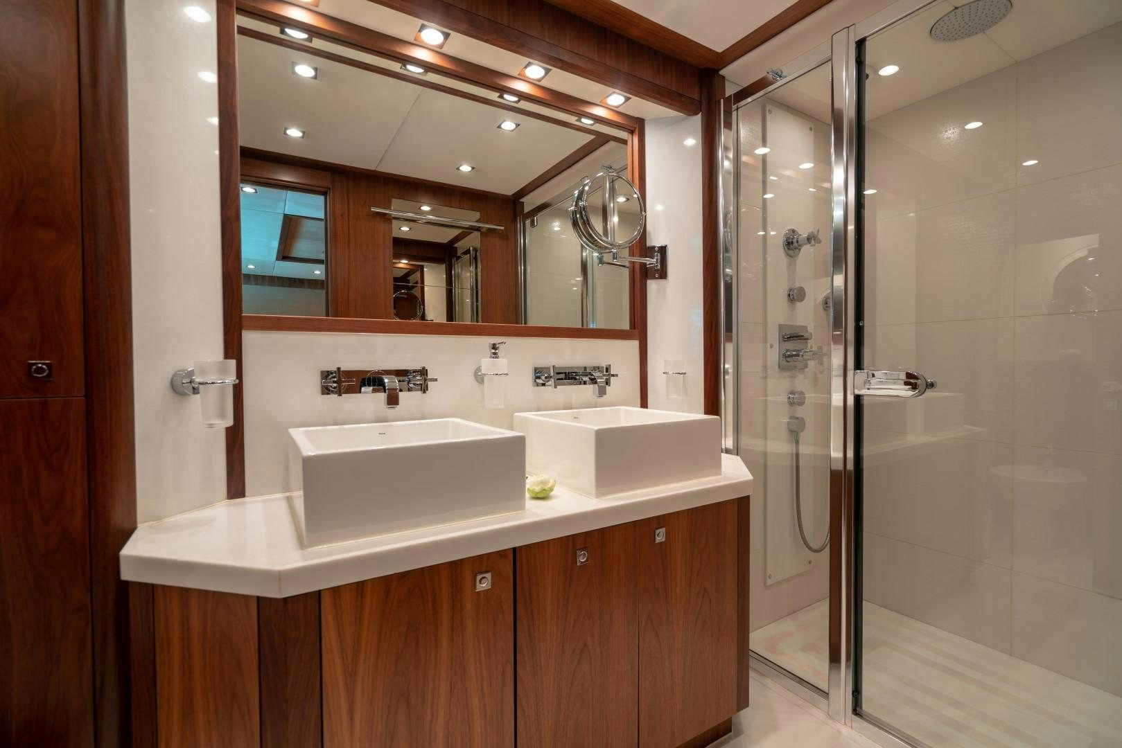 a bathroom with a large mirror aboard ABOUT TIME Yacht for Sale