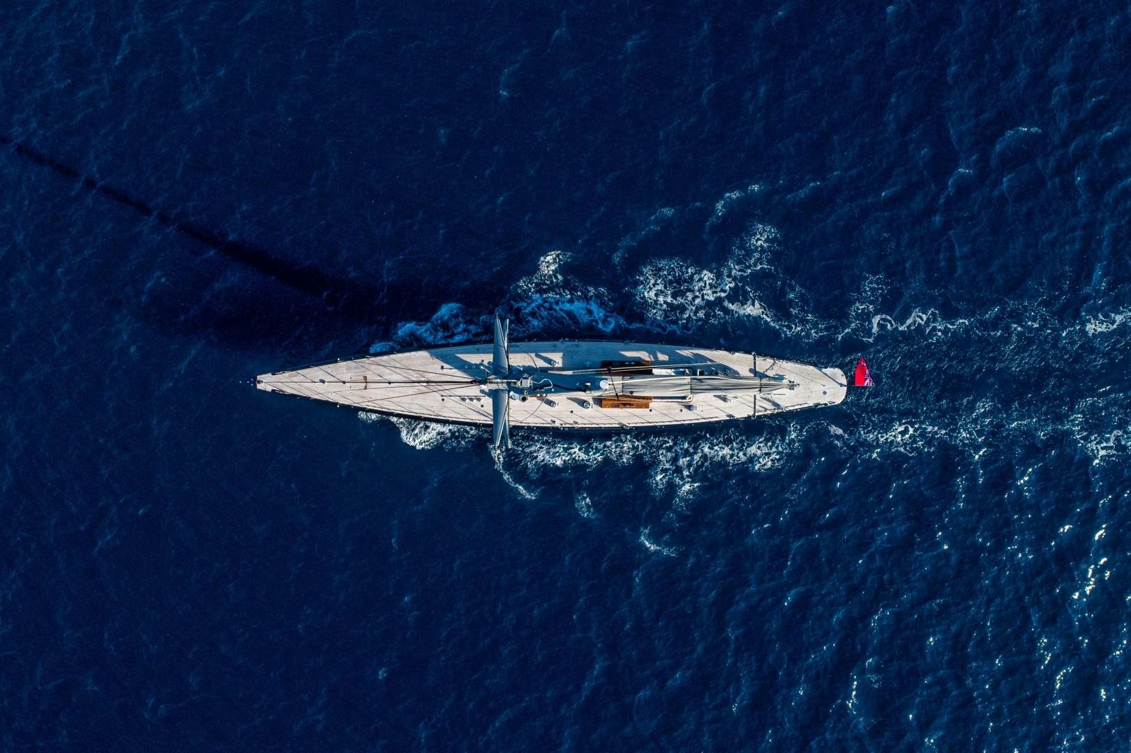 a plane flying over a sea aboard RAINBOW Yacht for Sale
