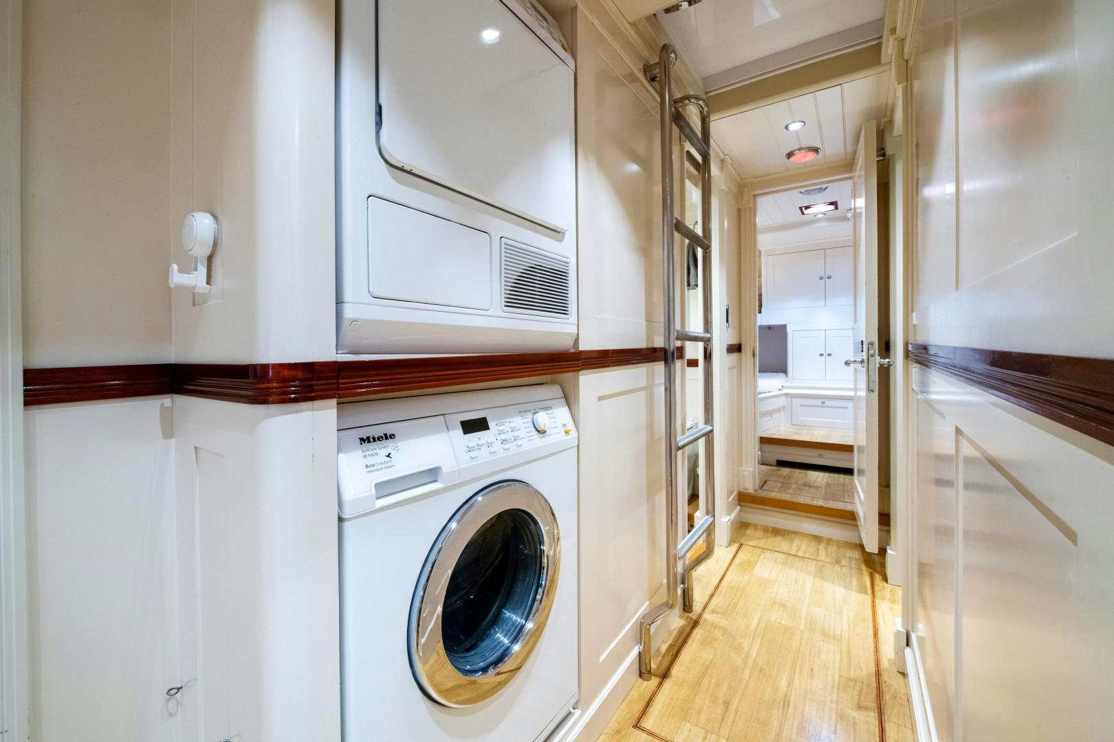a laundry room with a washing machine aboard RAINBOW Yacht for Sale