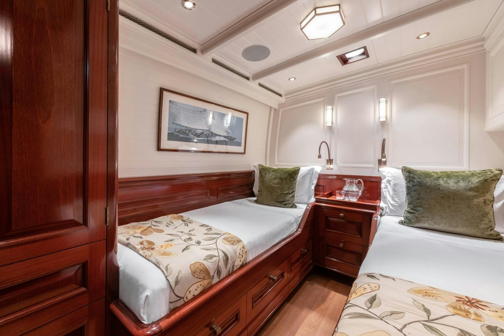a couple of beds in a hotel room aboard RAINBOW Yacht for Sale
