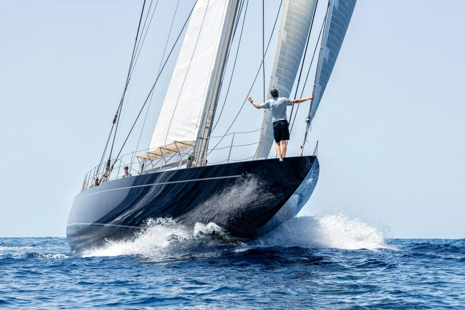 a man on a sailboat aboard RAINBOW Yacht for Sale