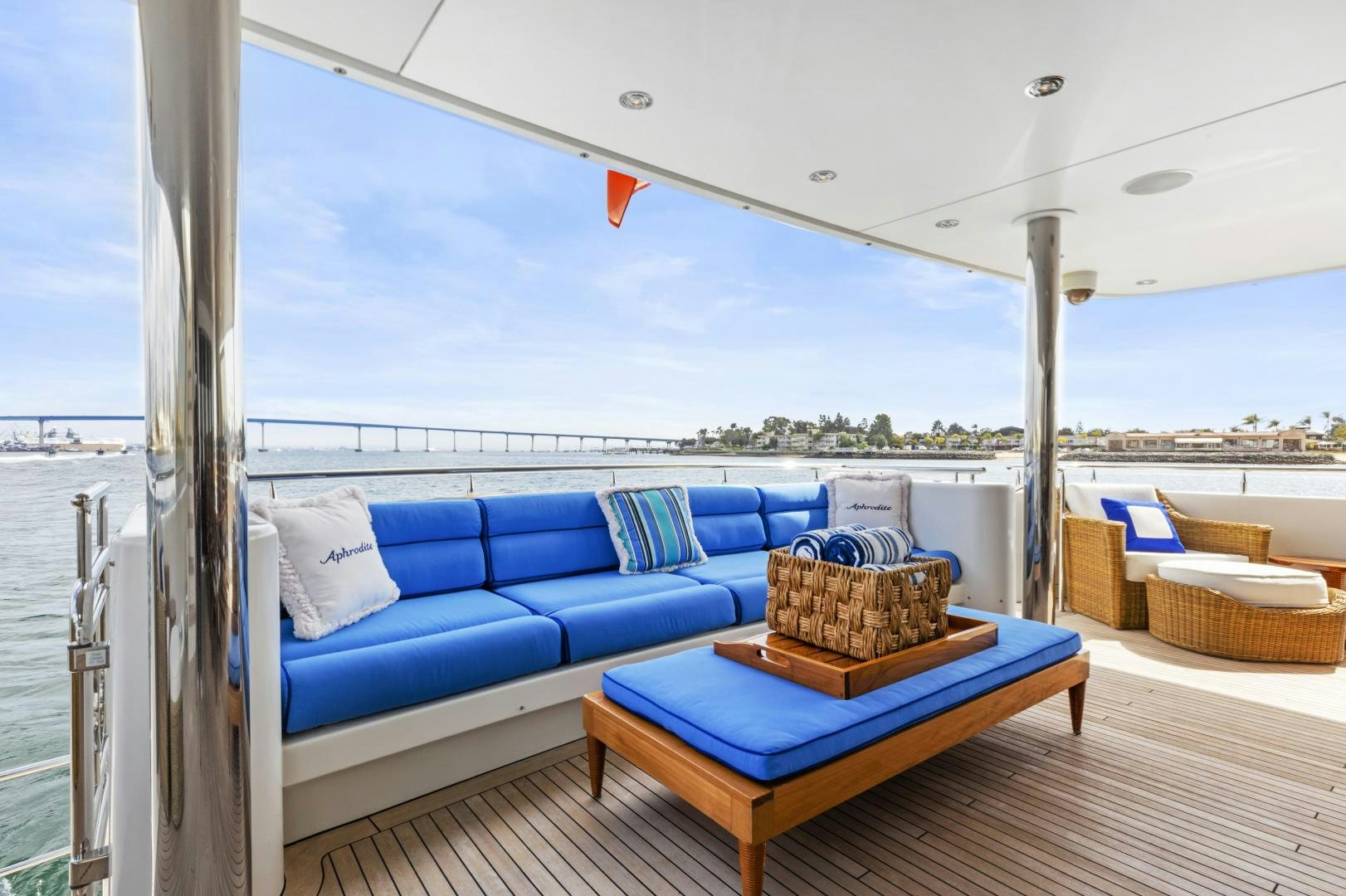 a couch and a table on a deck aboard APHRODITE Yacht for Sale