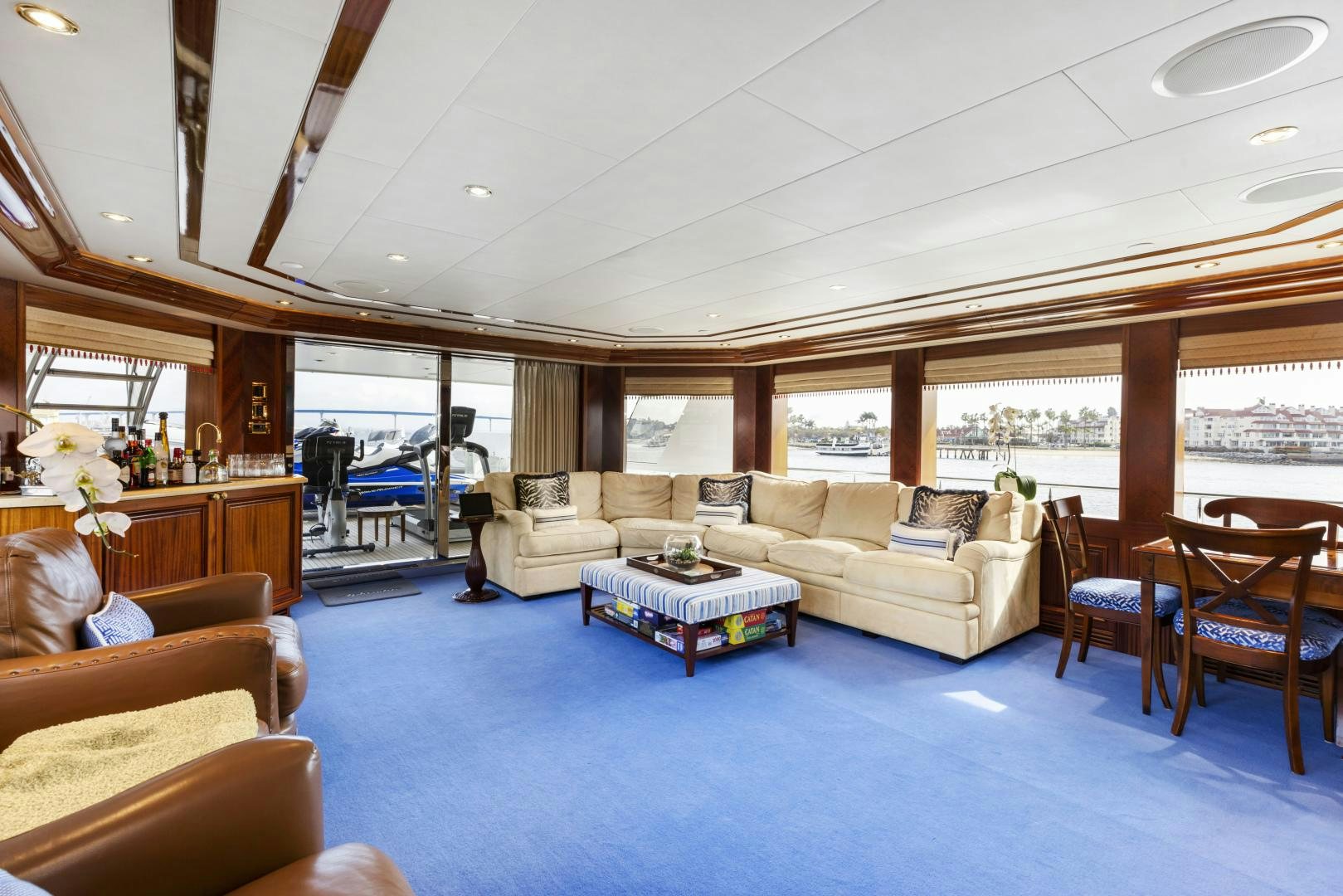 a living room with a couch and a table aboard APHRODITE Yacht for Sale