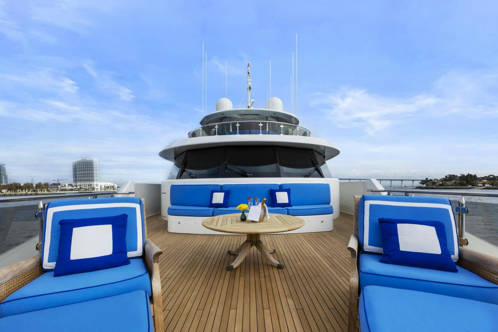 a boat on a dock with Camera Obscura in the background aboard APHRODITE Yacht for Sale