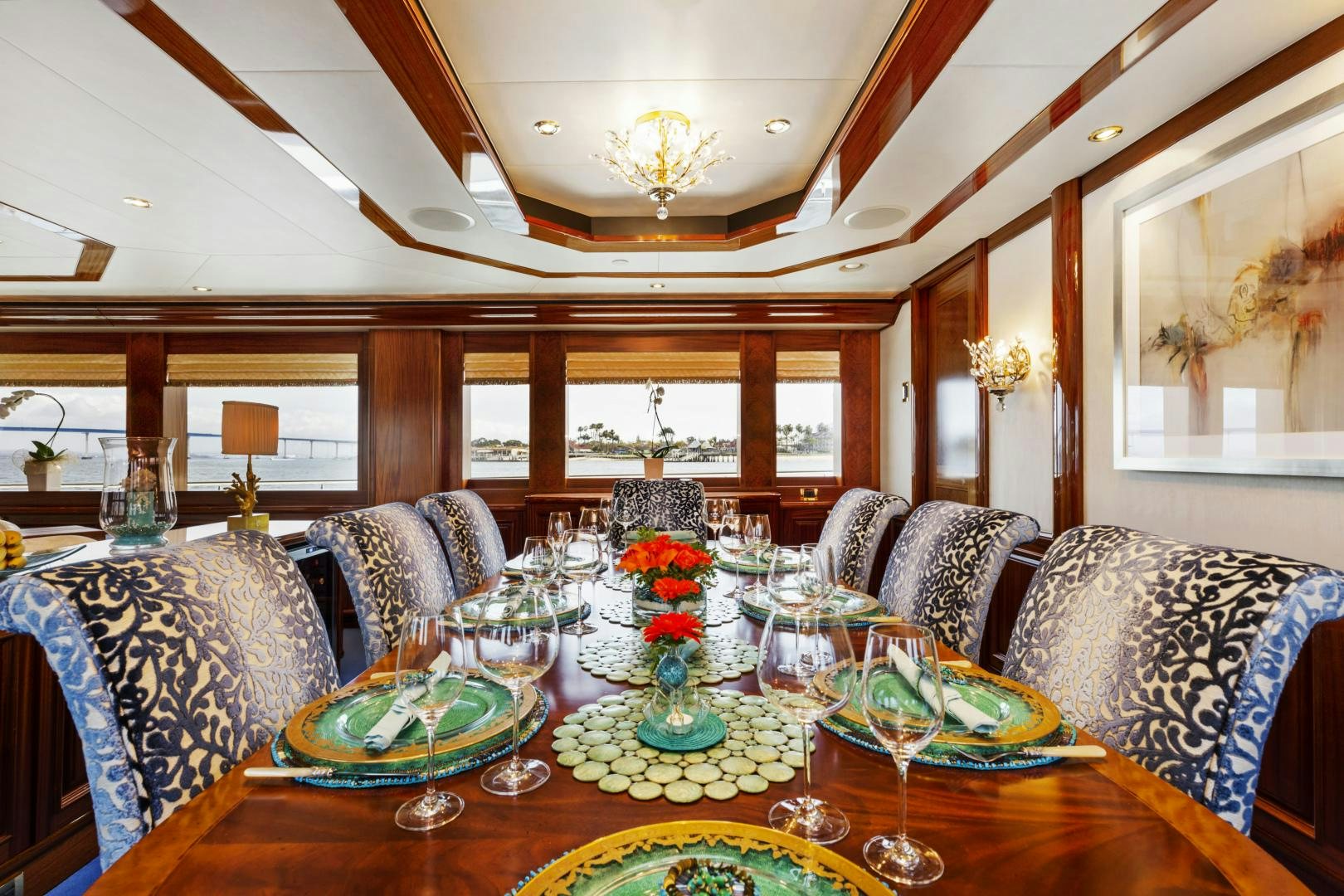 a large dining room with a large table and chairs aboard APHRODITE Yacht for Sale