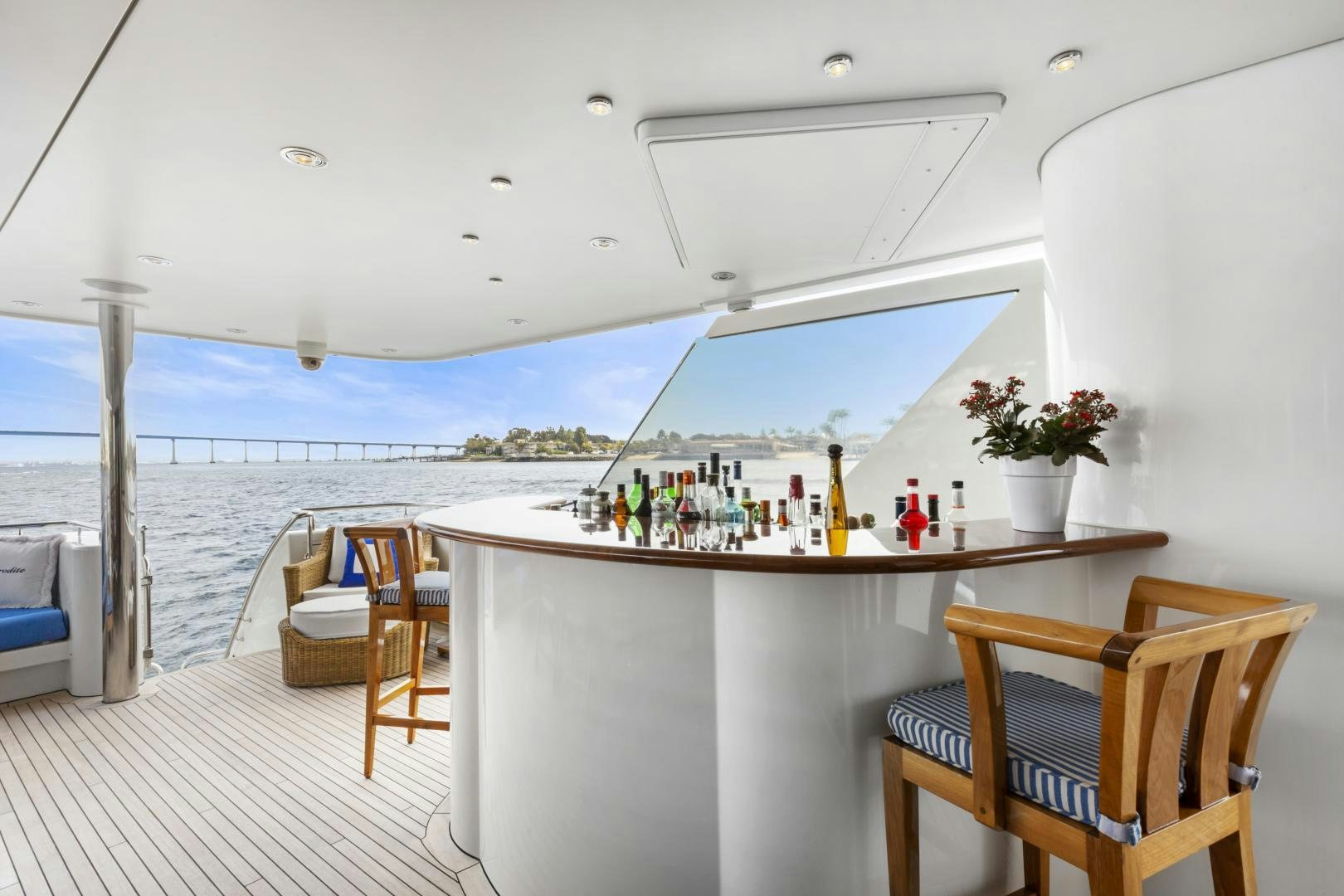 a table with chairs on it by the water aboard APHRODITE Yacht for Sale