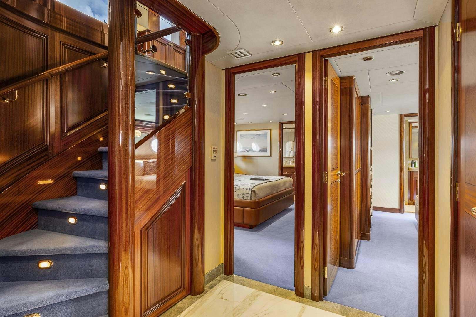 a room with a bed and a mirror aboard APHRODITE Yacht for Sale