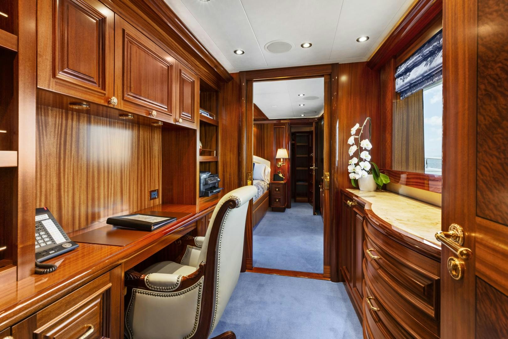 a room with a desk and chairs aboard APHRODITE Yacht for Sale
