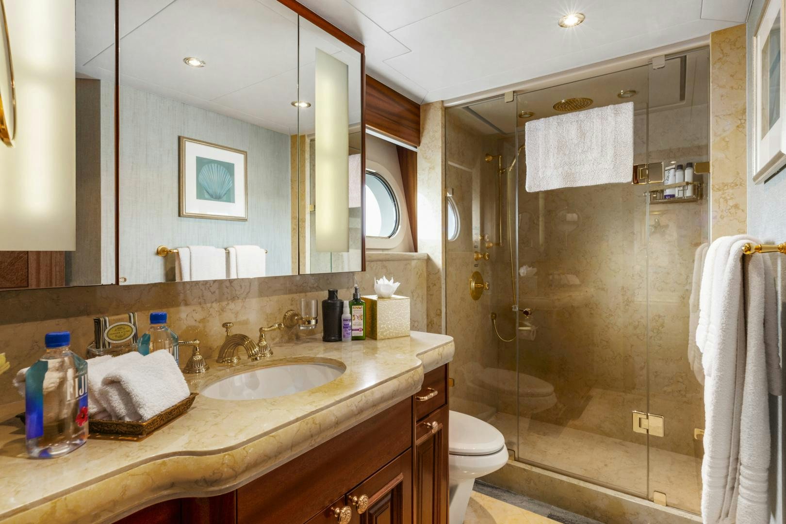 a bathroom with a sink and a shower aboard APHRODITE Yacht for Sale