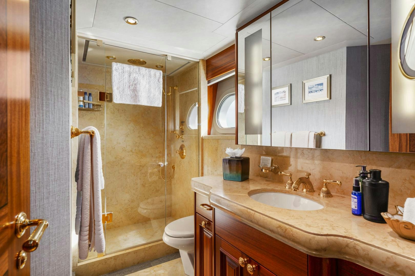 a bathroom with a sink and a mirror aboard APHRODITE Yacht for Sale
