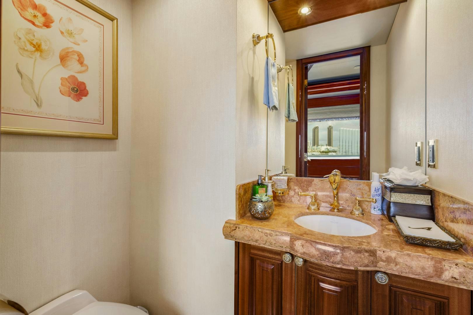 a bathroom with a sink and mirror aboard APHRODITE Yacht for Sale