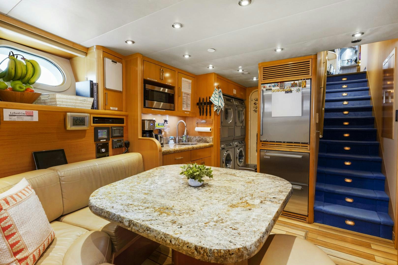 a kitchen with a large island aboard APHRODITE Yacht for Sale