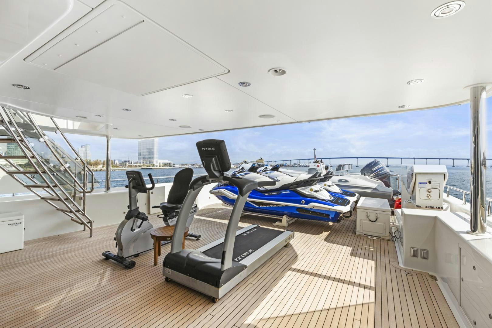 a deck with a pool table and chairs aboard APHRODITE Yacht for Sale