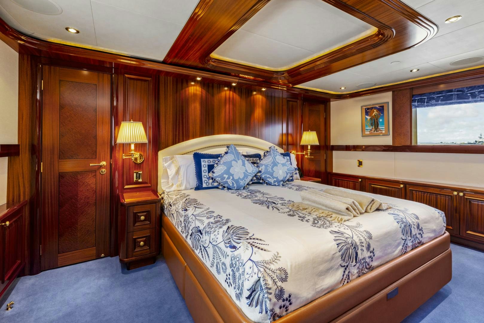 a bedroom with two beds aboard APHRODITE Yacht for Sale