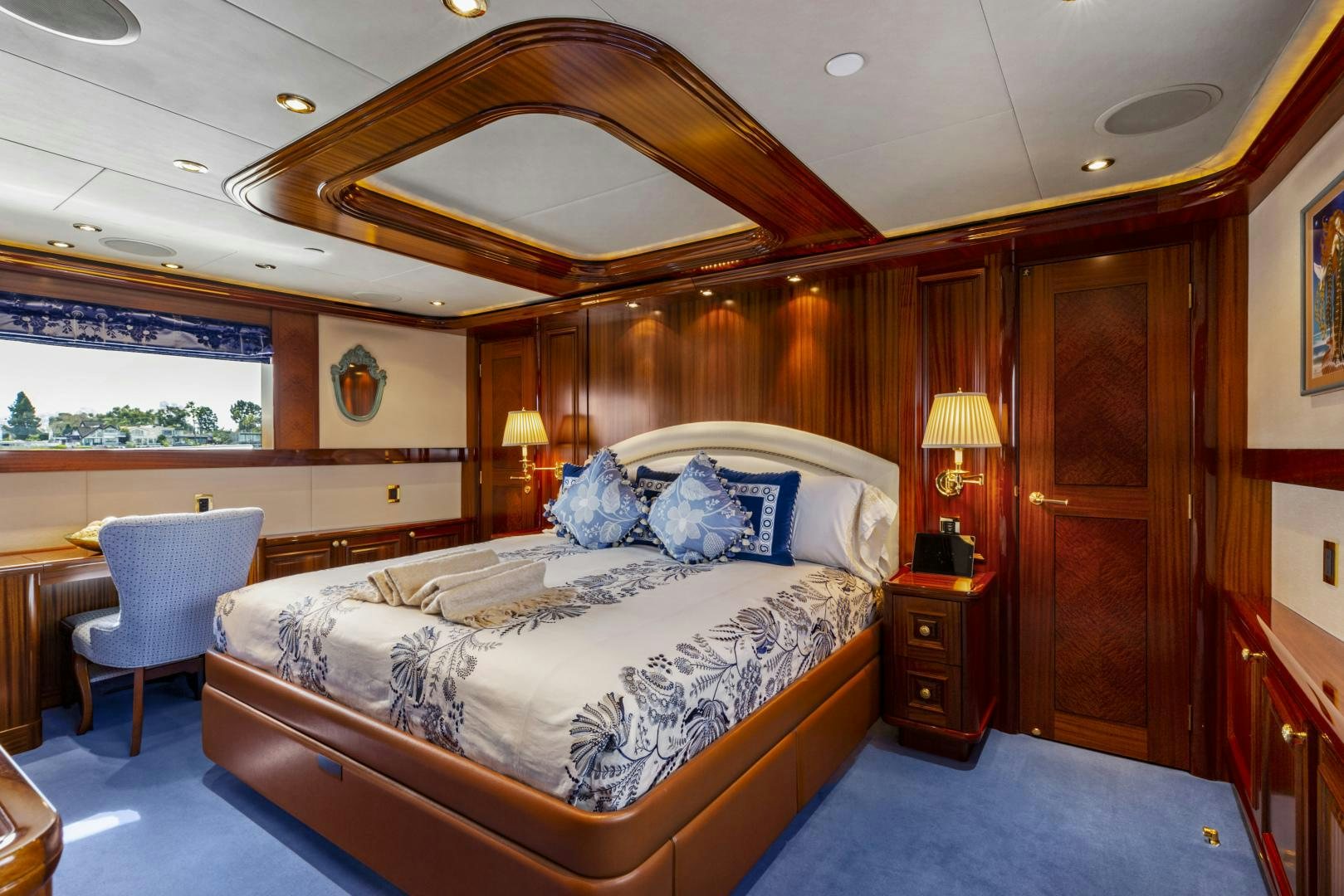 a bedroom with a large bed aboard APHRODITE Yacht for Sale